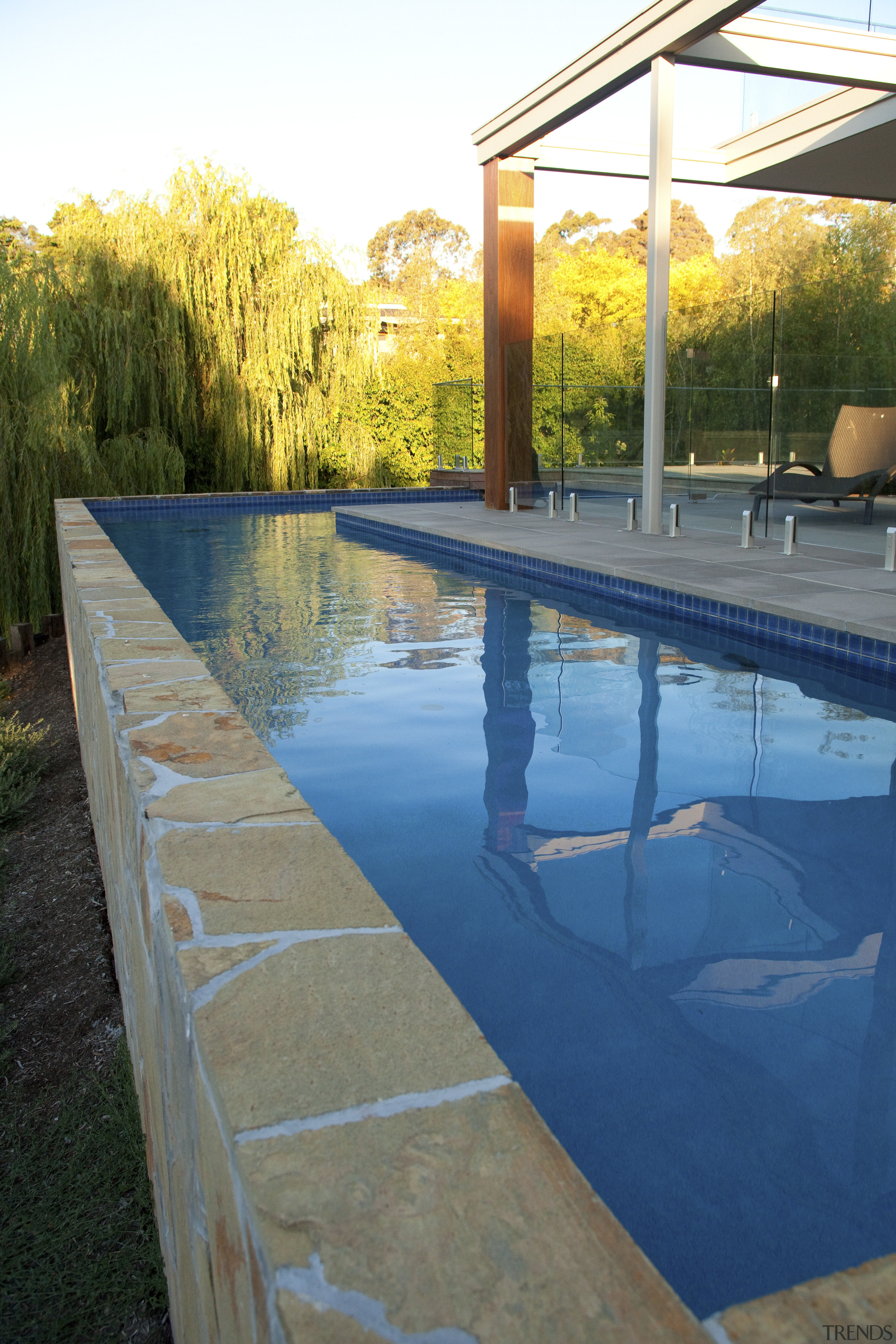 pool view Transformation  reinvented residence by Graeme backyard, house, leisure, outdoor structure, plant, real estate, reflection, swimming pool, water