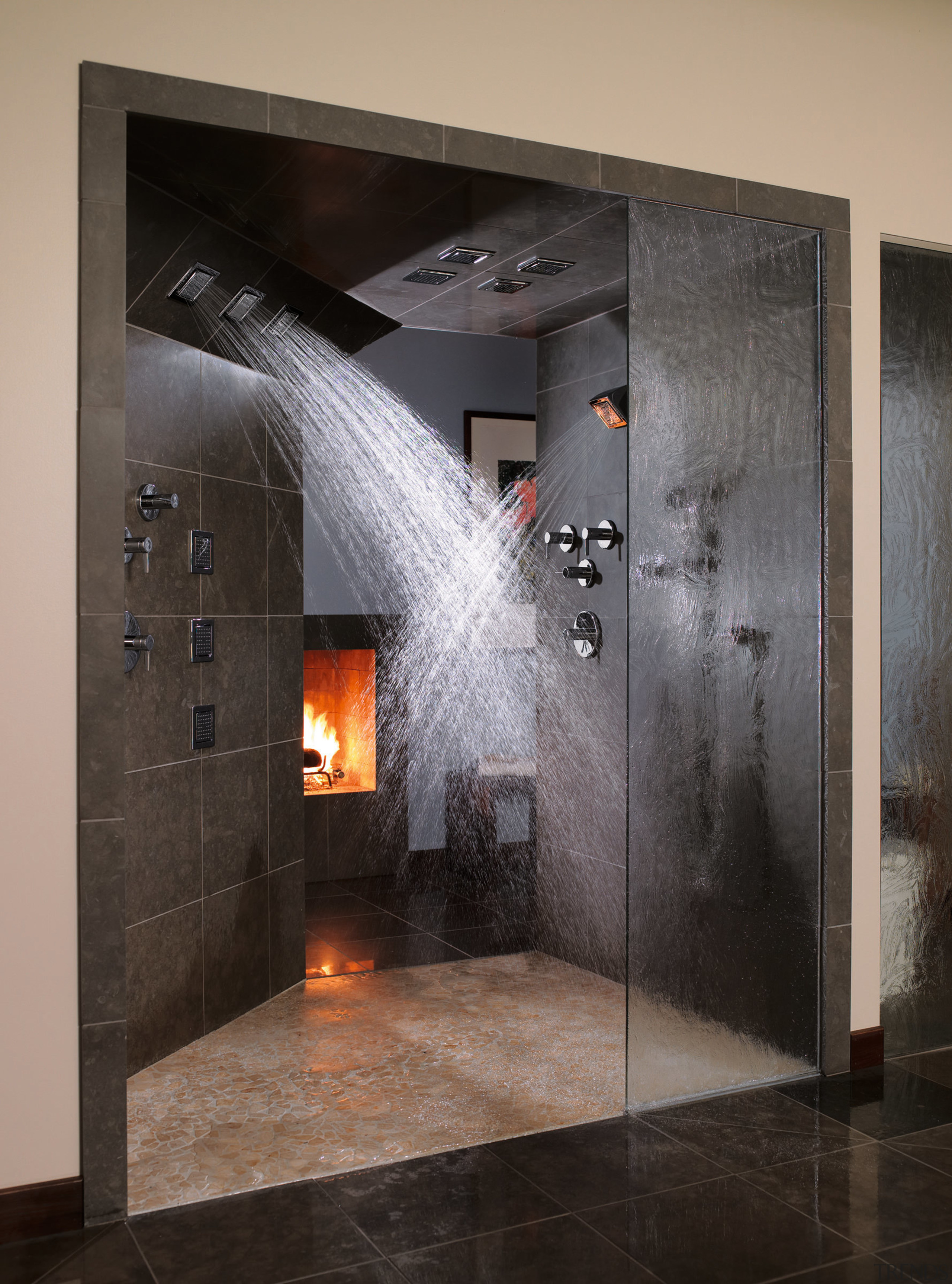 A view of these showers that feature the bathroom, fireplace, floor, flooring, hearth, interior design, black, gray