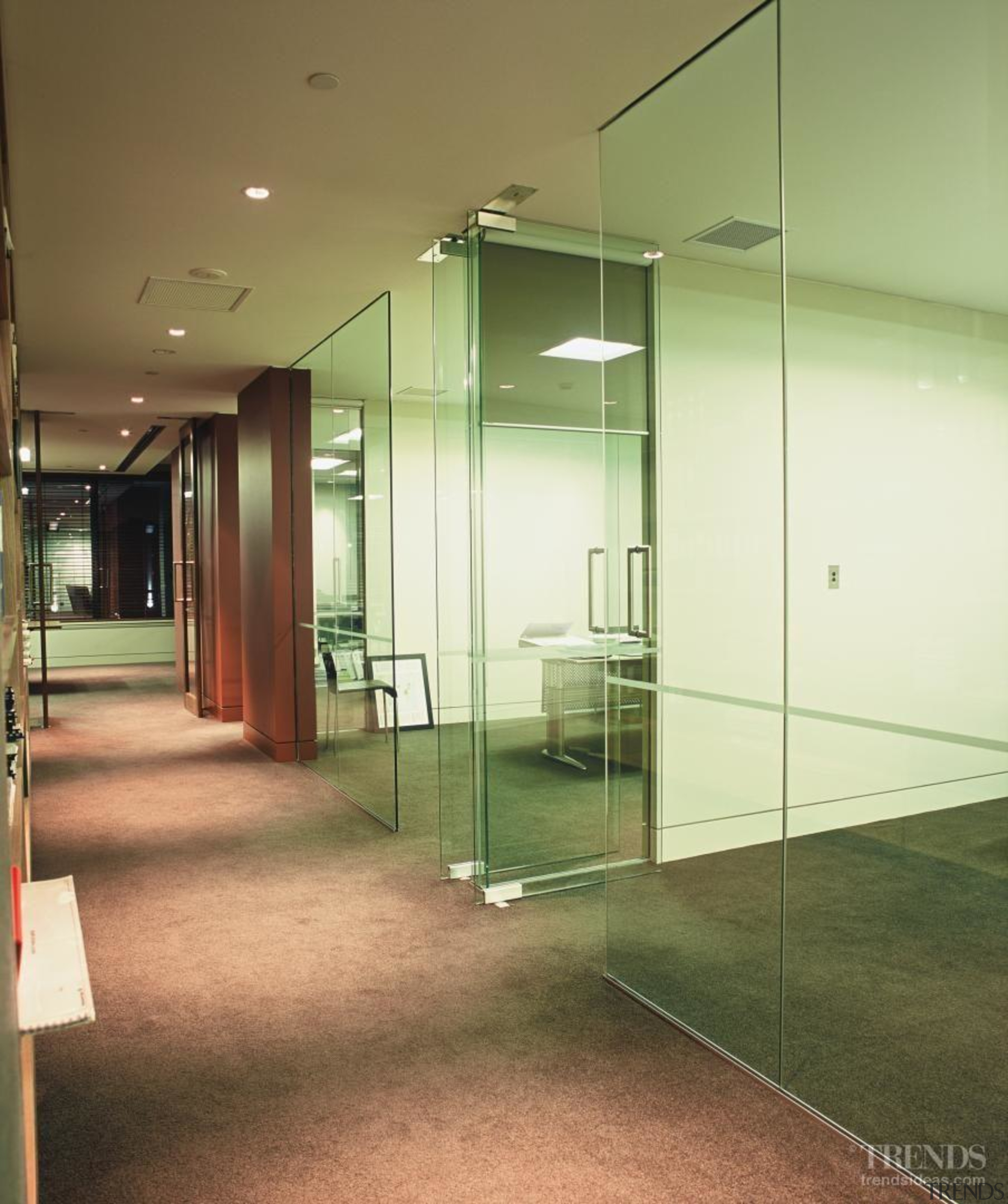 Glass wall partitioning separates some of the office architecture, ceiling, daylighting, floor, glass, handrail, house, interior design, lobby, real estate, wall, brown