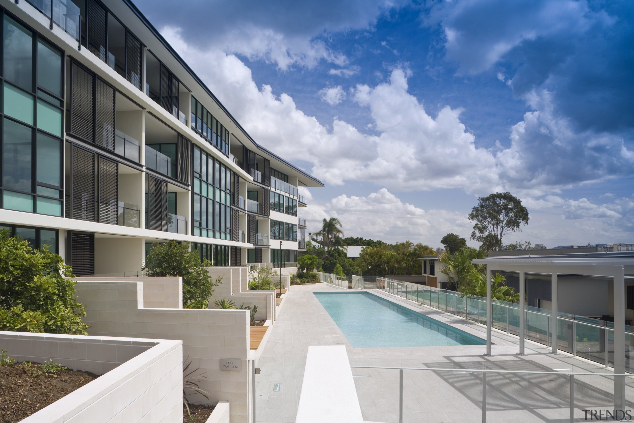 View of the Norman Reach development which is apartment, architecture, condominium, estate, home, house, property, real estate, residential area, resort, sky, swimming pool, villa, gray