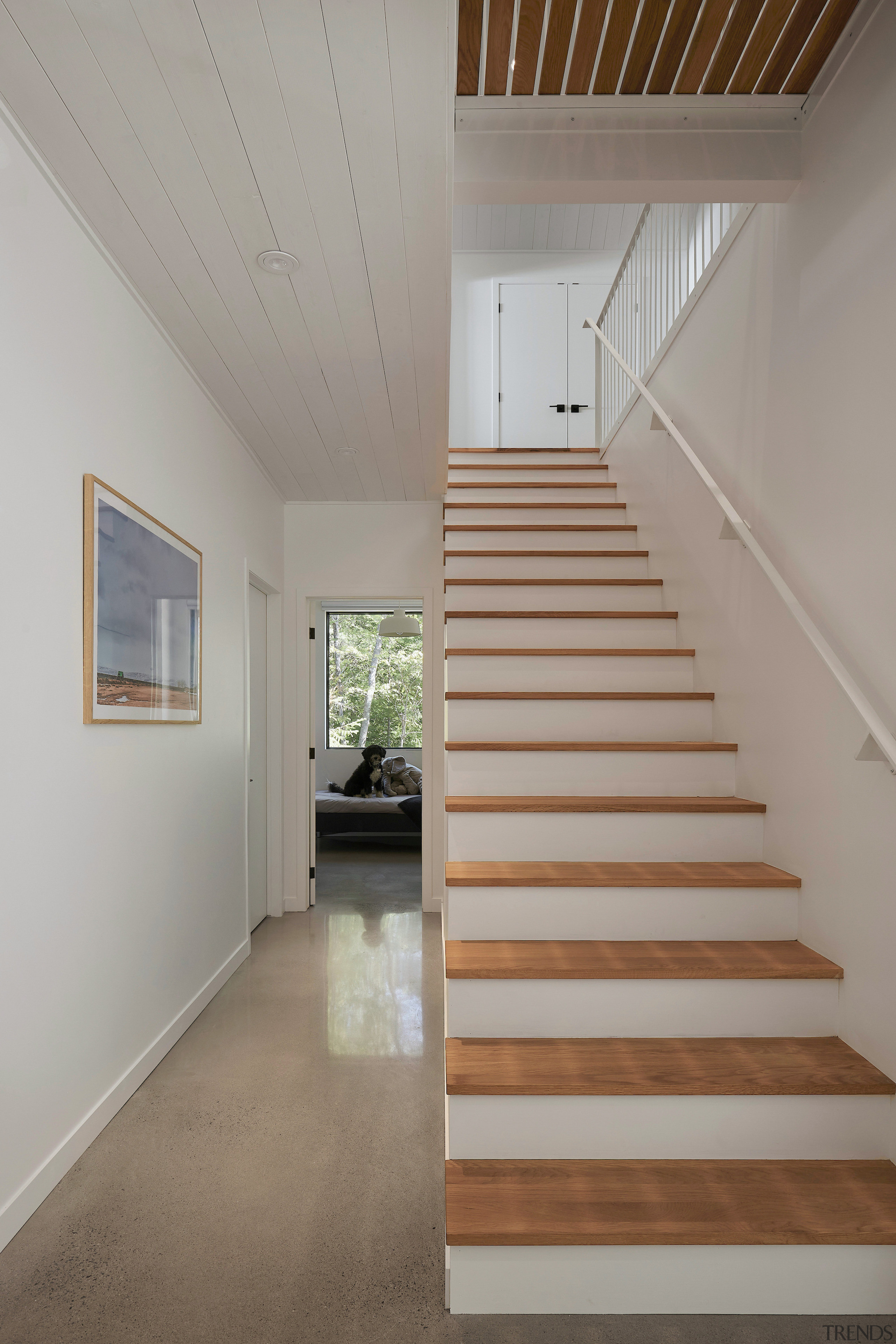 The oak staircase divides the upstairs spaces. 