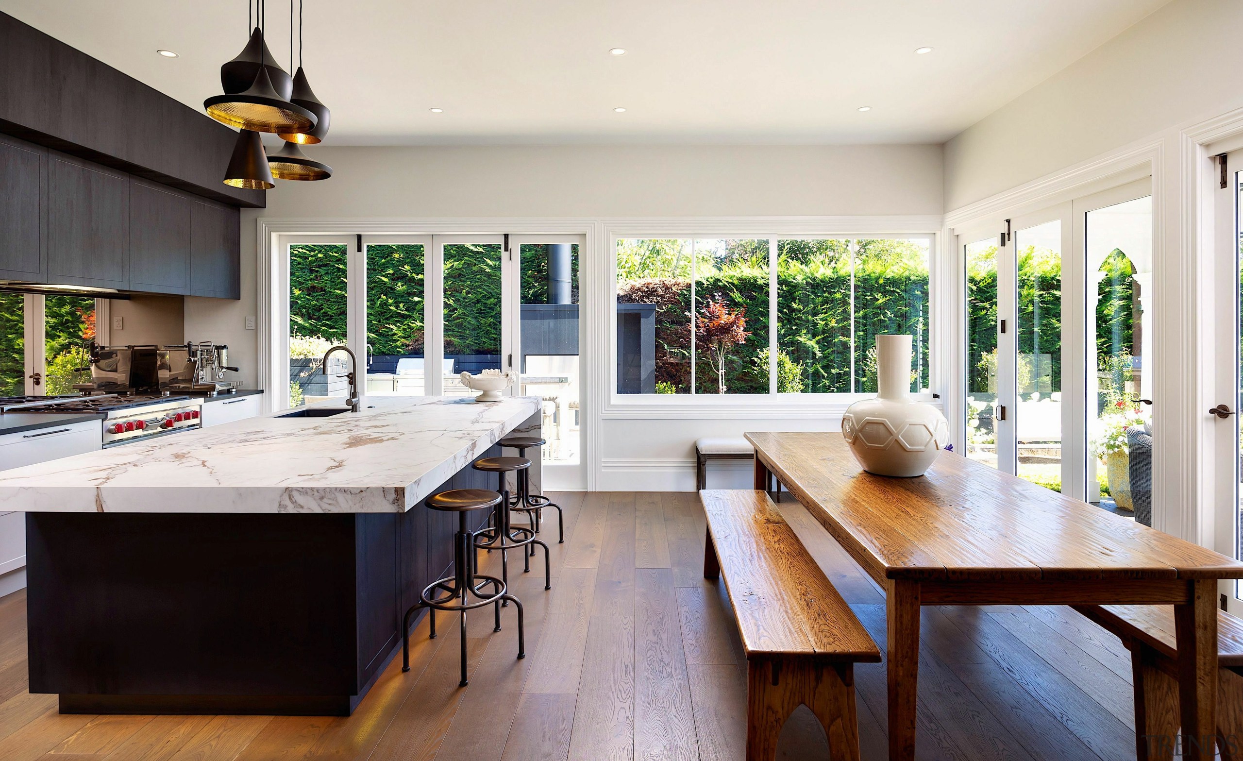 Bench seating serving the dining table allows for 