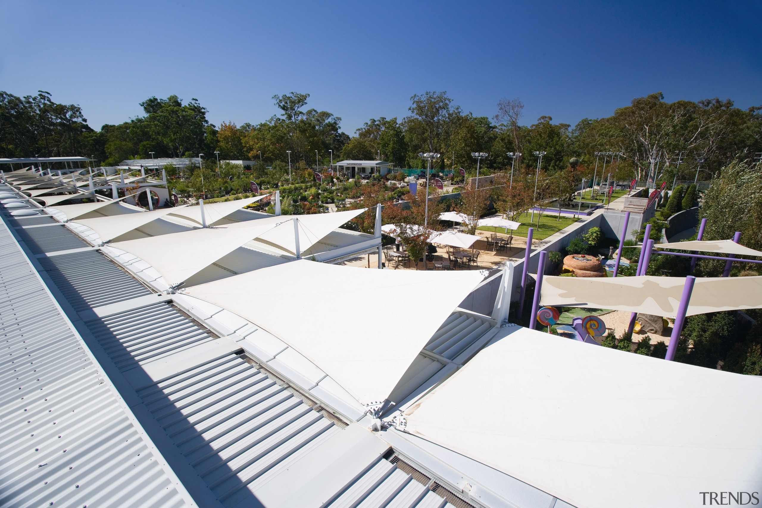 A view of the shade sails over a architecture, daylighting, outdoor structure, roof, tree, vacation, white