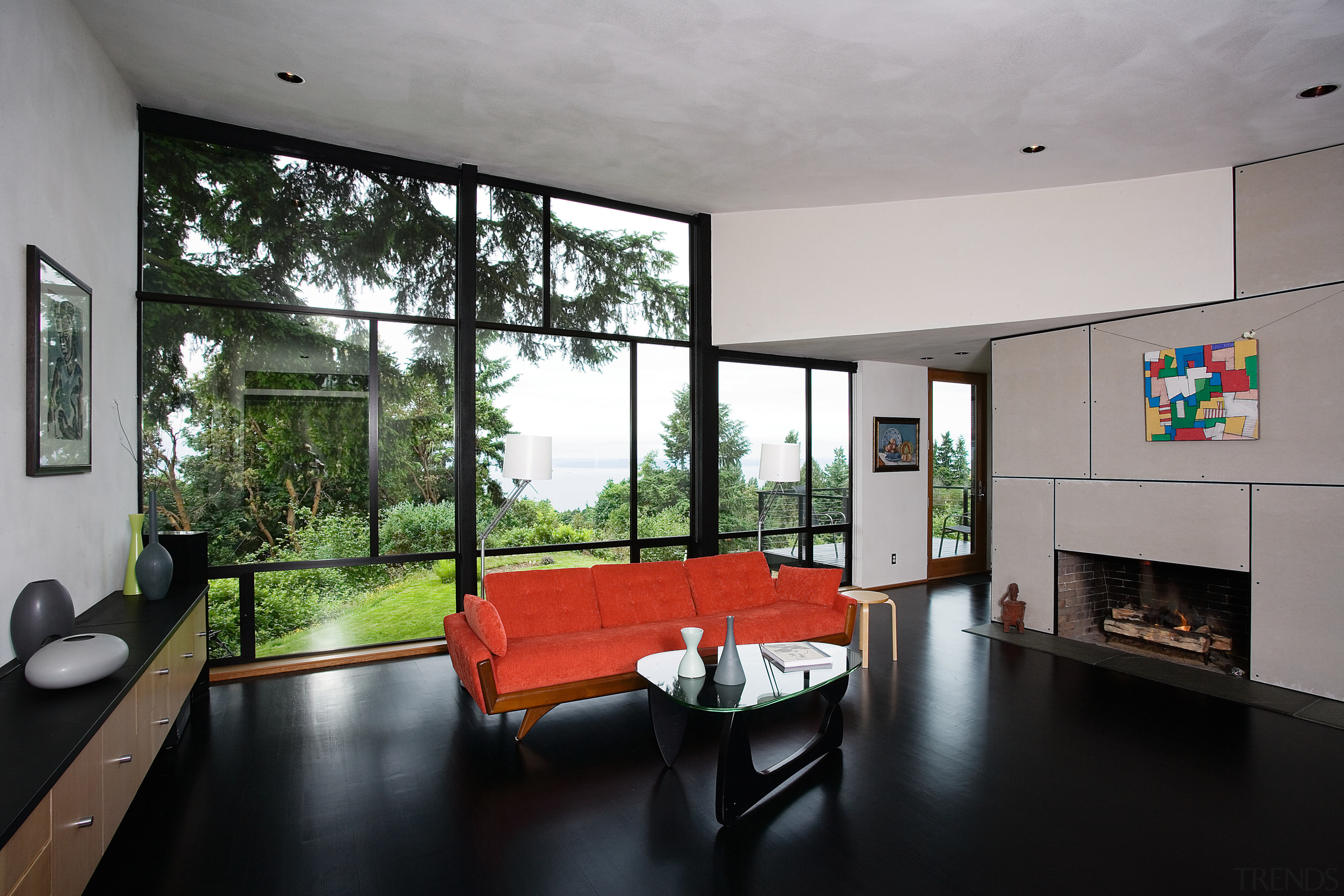 view of sthe living area featuring oak flooring, architecture, ceiling, house, interior design, living room, real estate, room, window, gray, black