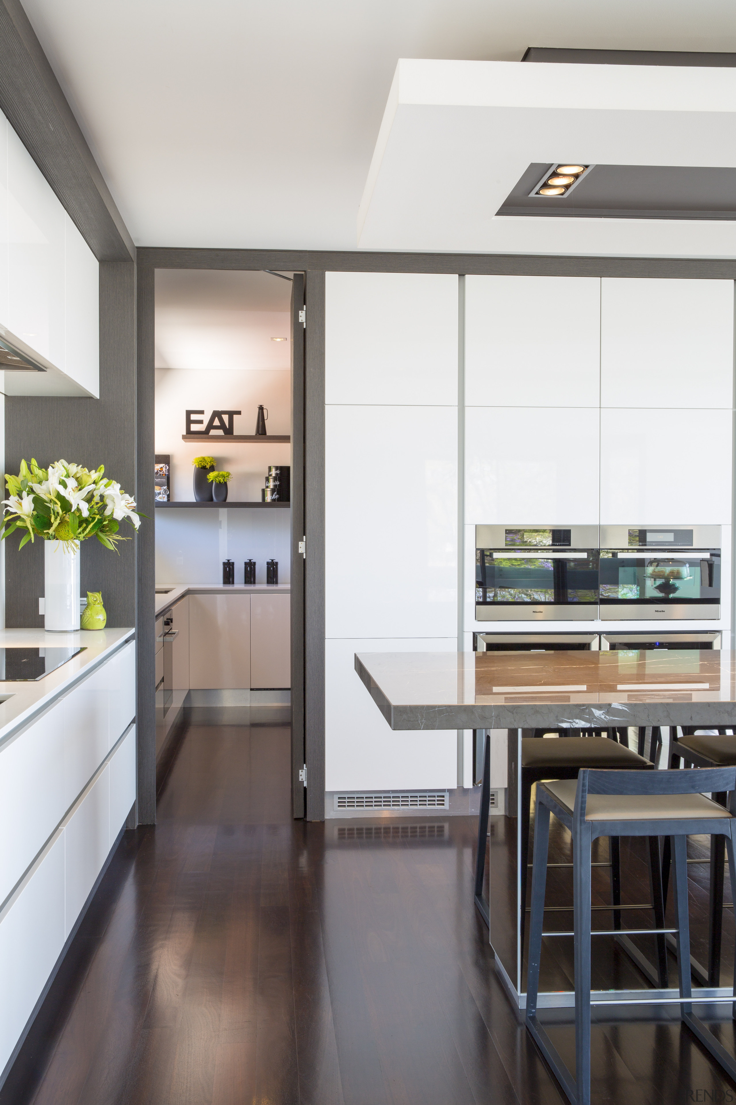 Contemporary kitchen with marble benchtop, handleless cabinetry and countertop, interior design, kitchen, white
