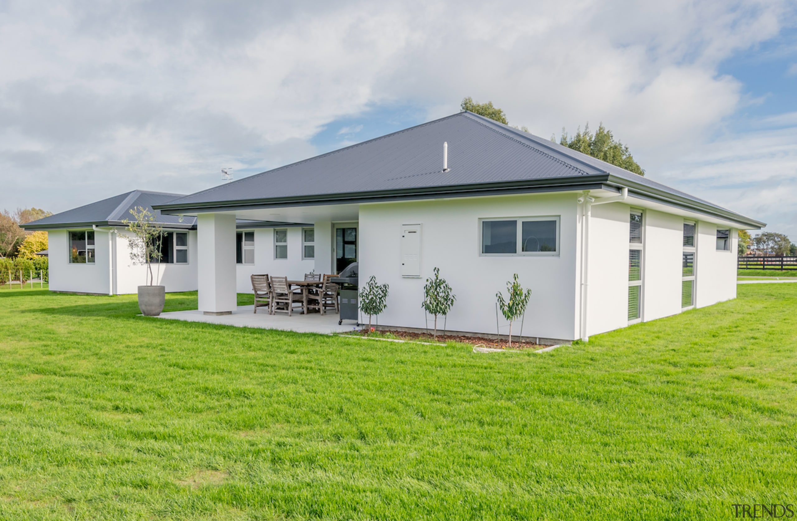 Award-winning home offers intelligent layouts and refined finishes cottage, elevation, estate, facade, farmhouse, grass, home, house, land lot, property, real estate, siding, gray, green