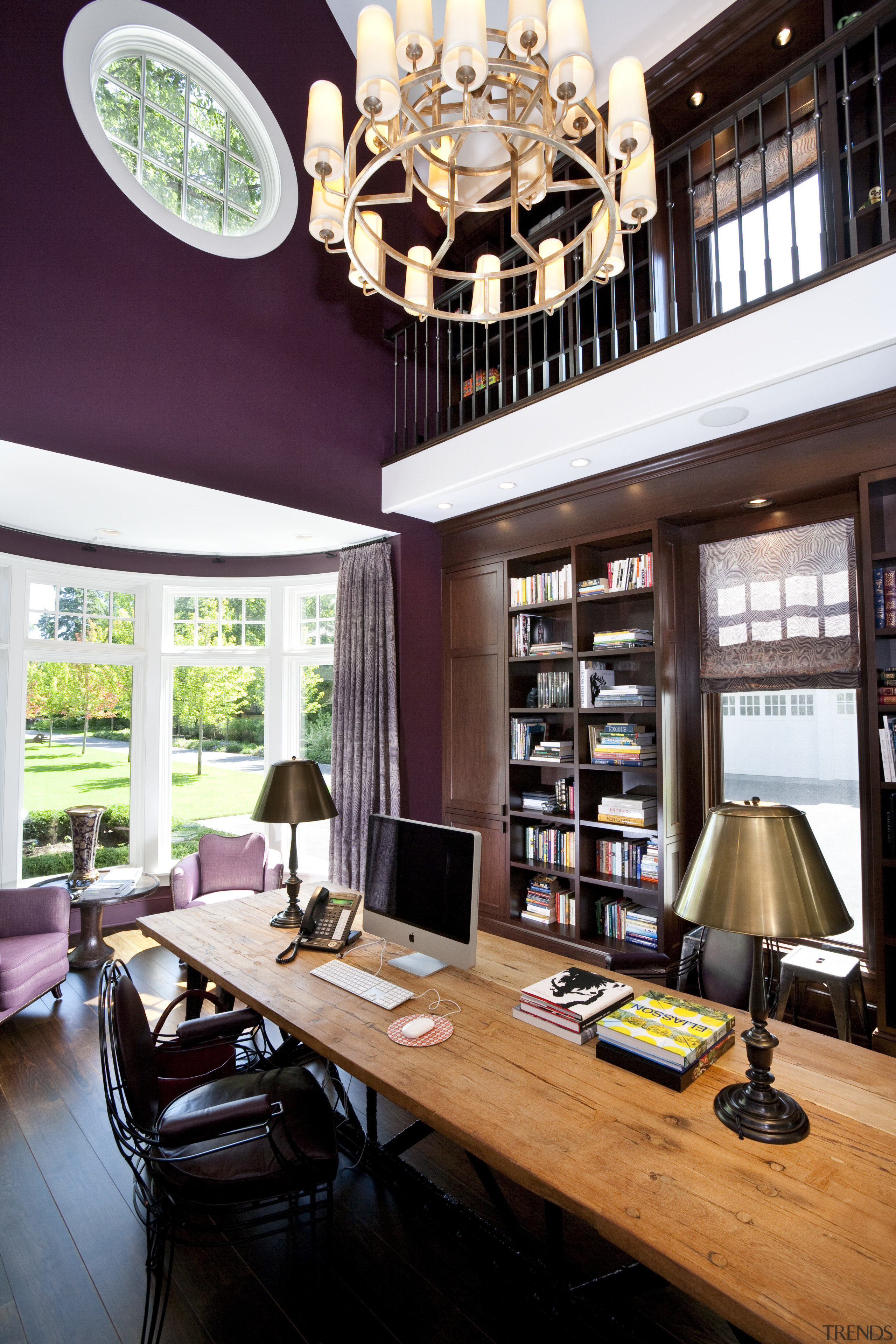 View of the library featuring dark painted walls, ceiling, dining room, furniture, home, interior design, living room, table, window, white