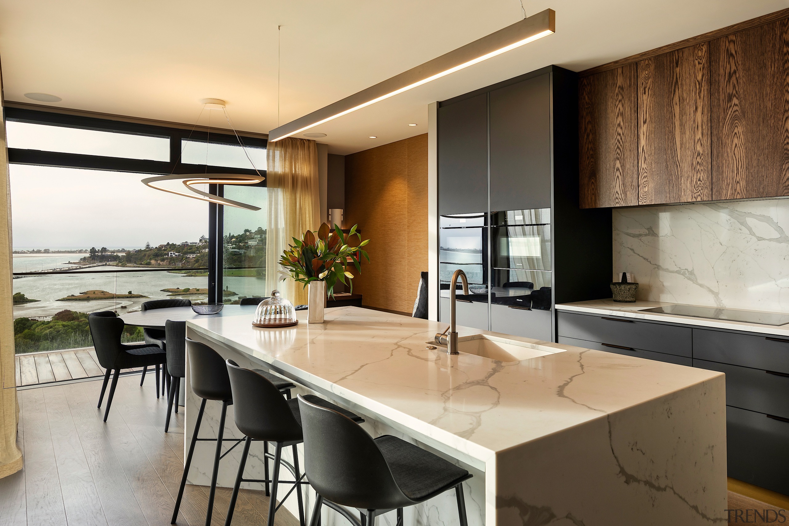 The kitchen looks out to the dining area 