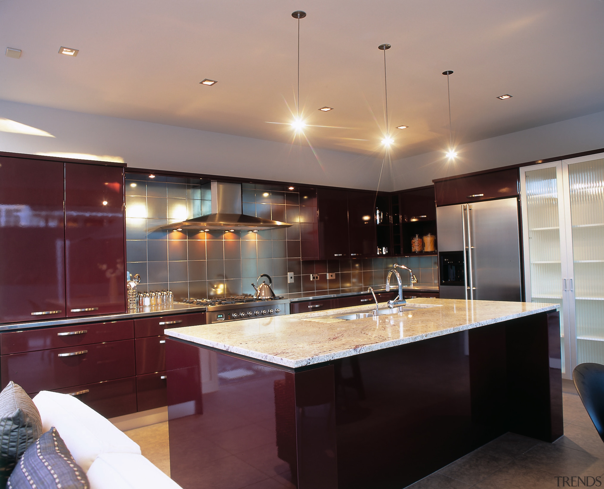 Kitchen with red brown cabinetry, stainless steel refrigerator cabinetry, ceiling, countertop, interior design, kitchen, real estate, room, under cabinet lighting, gray, red