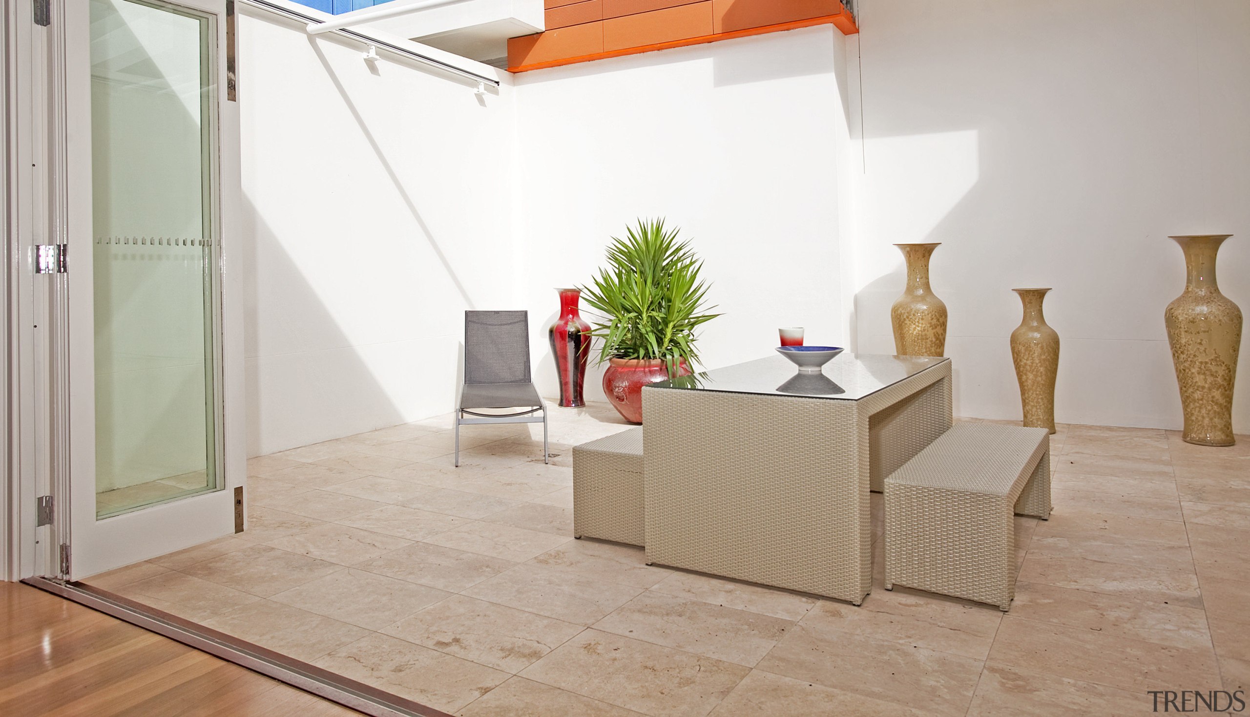 View of beachfront house with courtyard, formal living floor, flooring, furniture, hardwood, interior design, laminate flooring, product design, property, table, tile, wood, wood flooring, gray