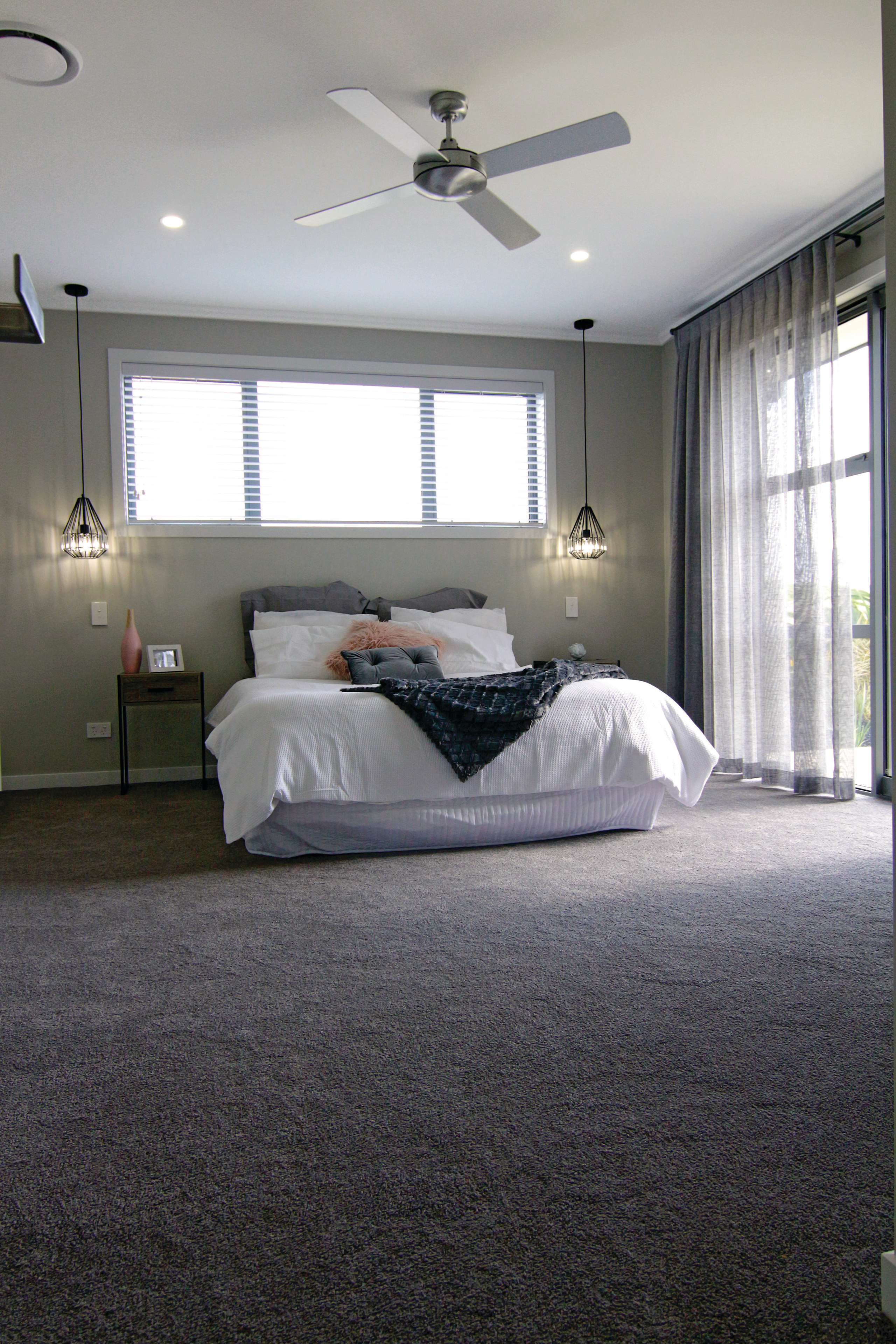 The master bedroom in this Fowler Homes Orewa architecture, bed frame, bedroom, ceiling, floor, room, gray, black
