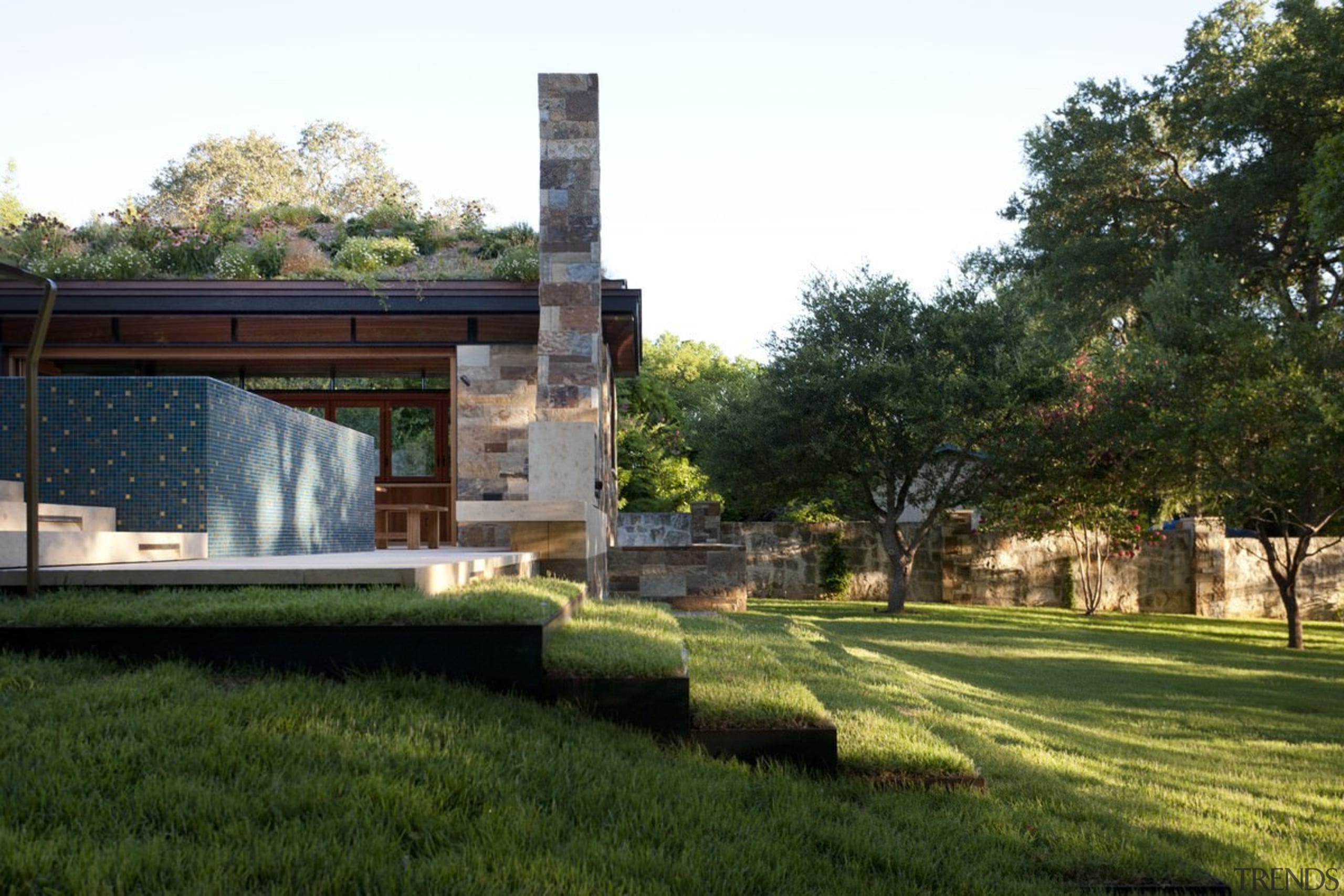 Grass steps lead down from the pool house architecture, estate, grass, home, house, landscape, property, real estate, tree, brown