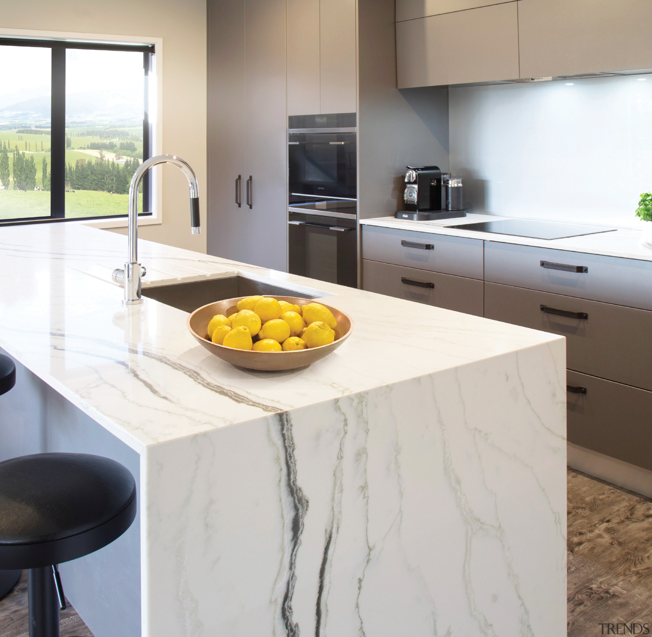 This eye-catching kitchen, also by designer Kim Primrose, countertop, floor, flooring, interior design, kitchen, table, yellow, white