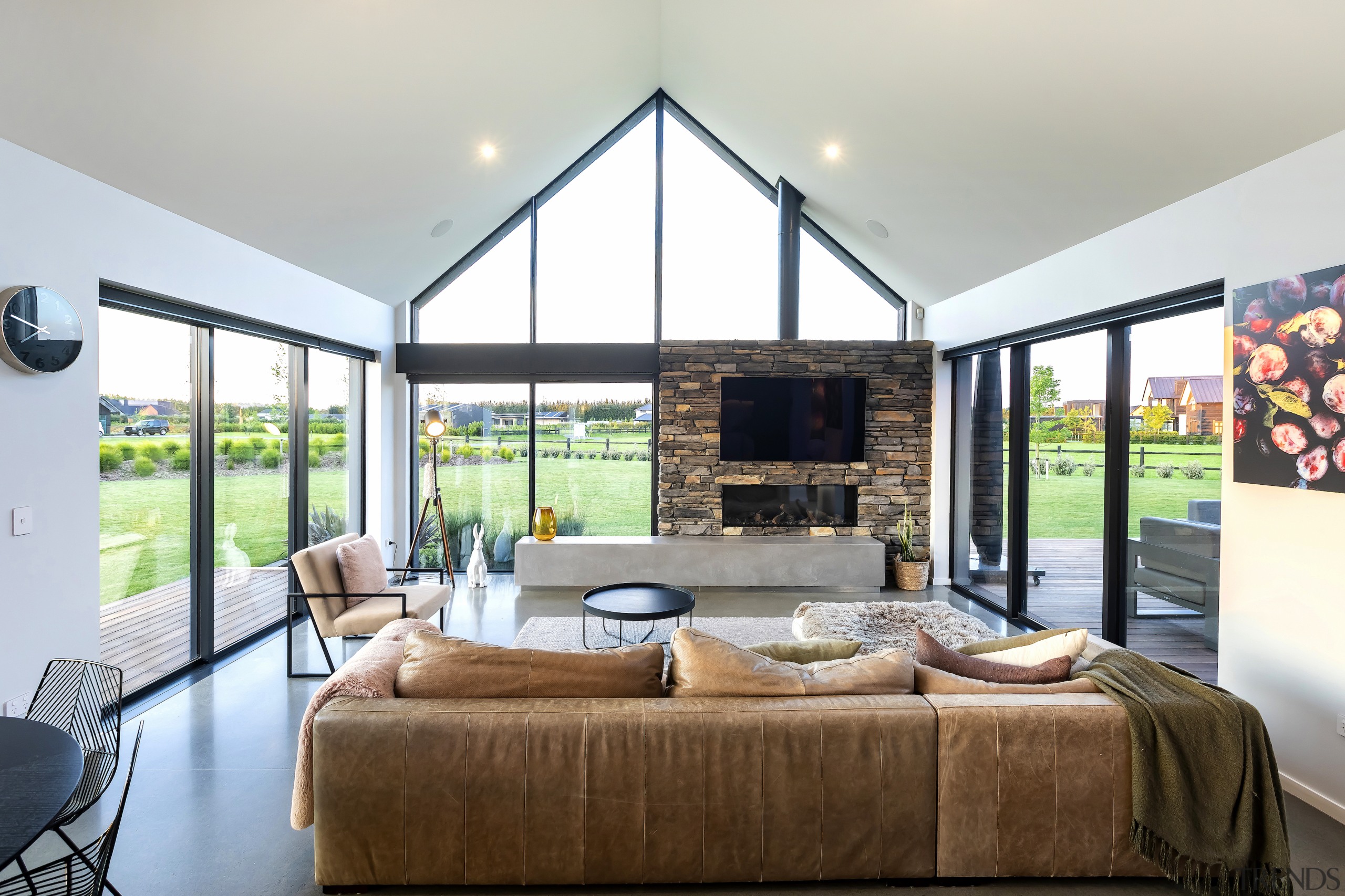 Living area wing with stone fireplace and gabled 