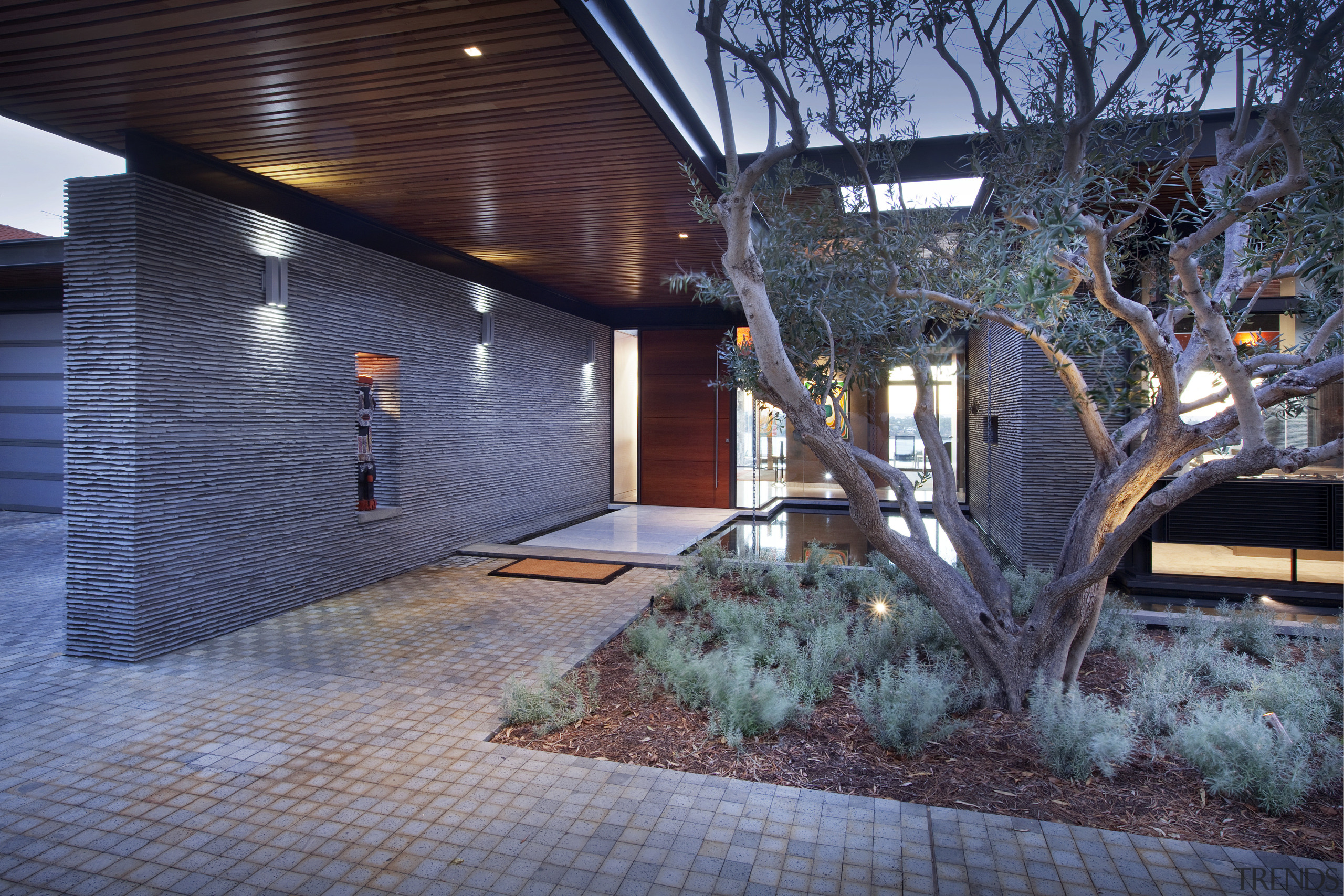 This house was designed by architect Martin Grounds architecture, backyard, building, courtyard, facade, home, house, property, real estate, residential area, siding, tree, blue