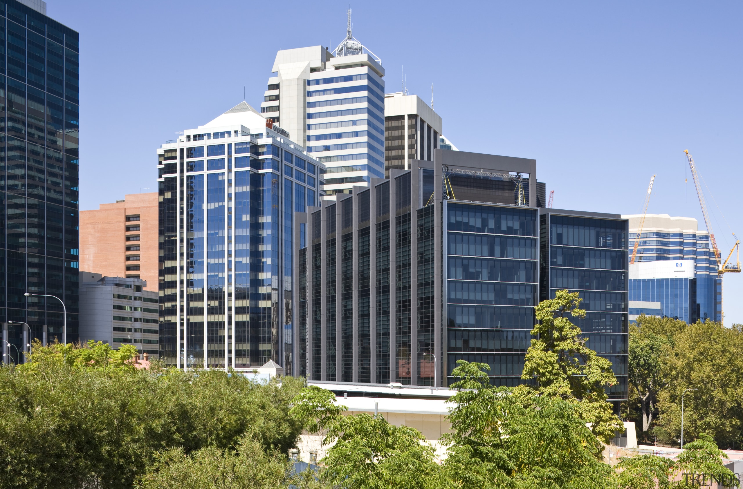 Exterior view of the eco-friendly commercial office tower building, city, cityscape, commercial building, condominium, corporate headquarters, daytime, downtown, headquarters, metropolis, metropolitan area, mixed use, neighbourhood, real estate, residential area, sky, skyline, skyscraper, tower block, urban area, teal