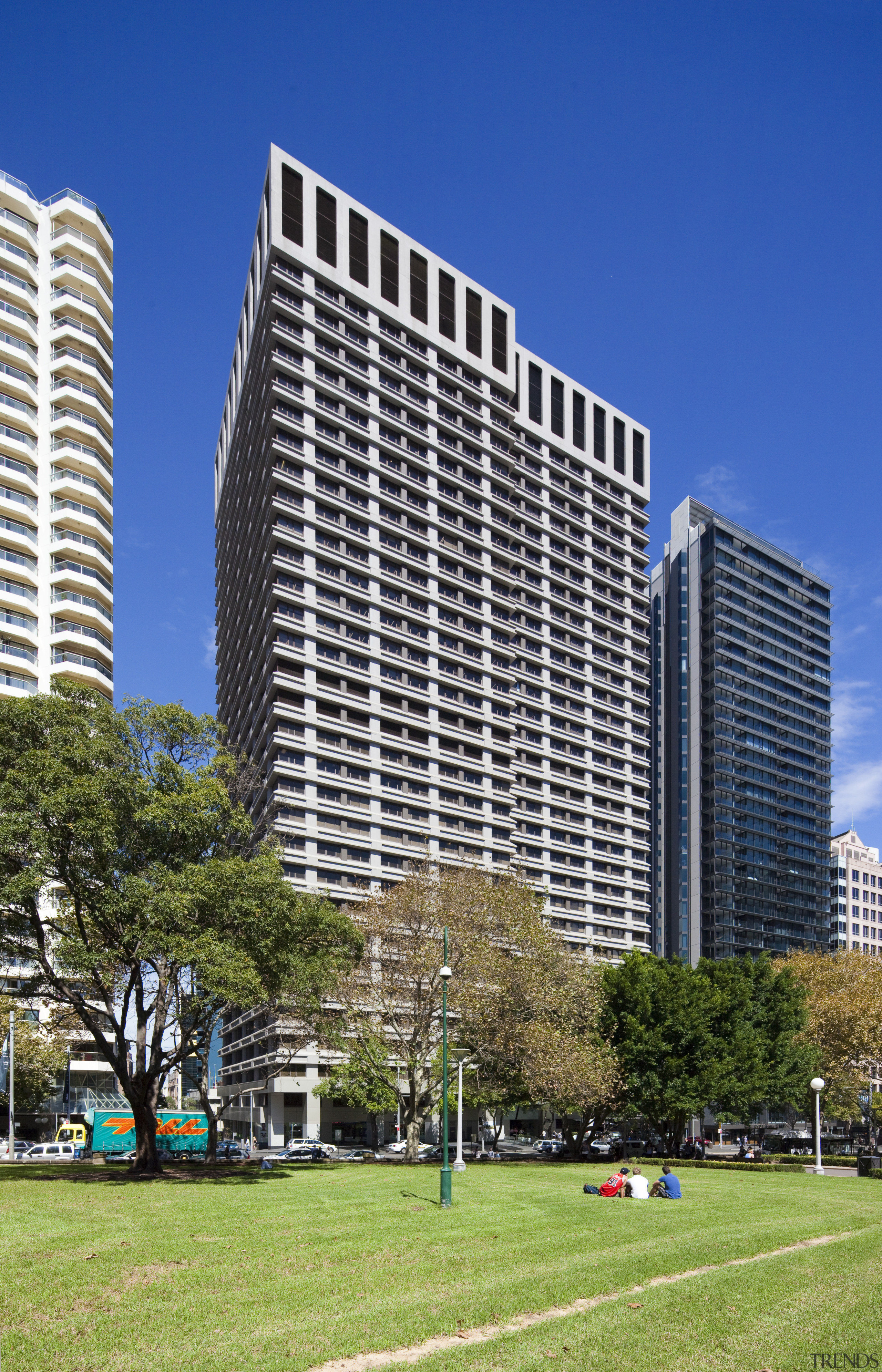 View of high rise office tower with wooden architecture, building, city, commercial building, condominium, corporate headquarters, daytime, downtown, facade, headquarters, landmark, metropolis, metropolitan area, mixed use, neighbourhood, real estate, residential area, sky, skyline, skyscraper, tower block, tree, urban area, blue