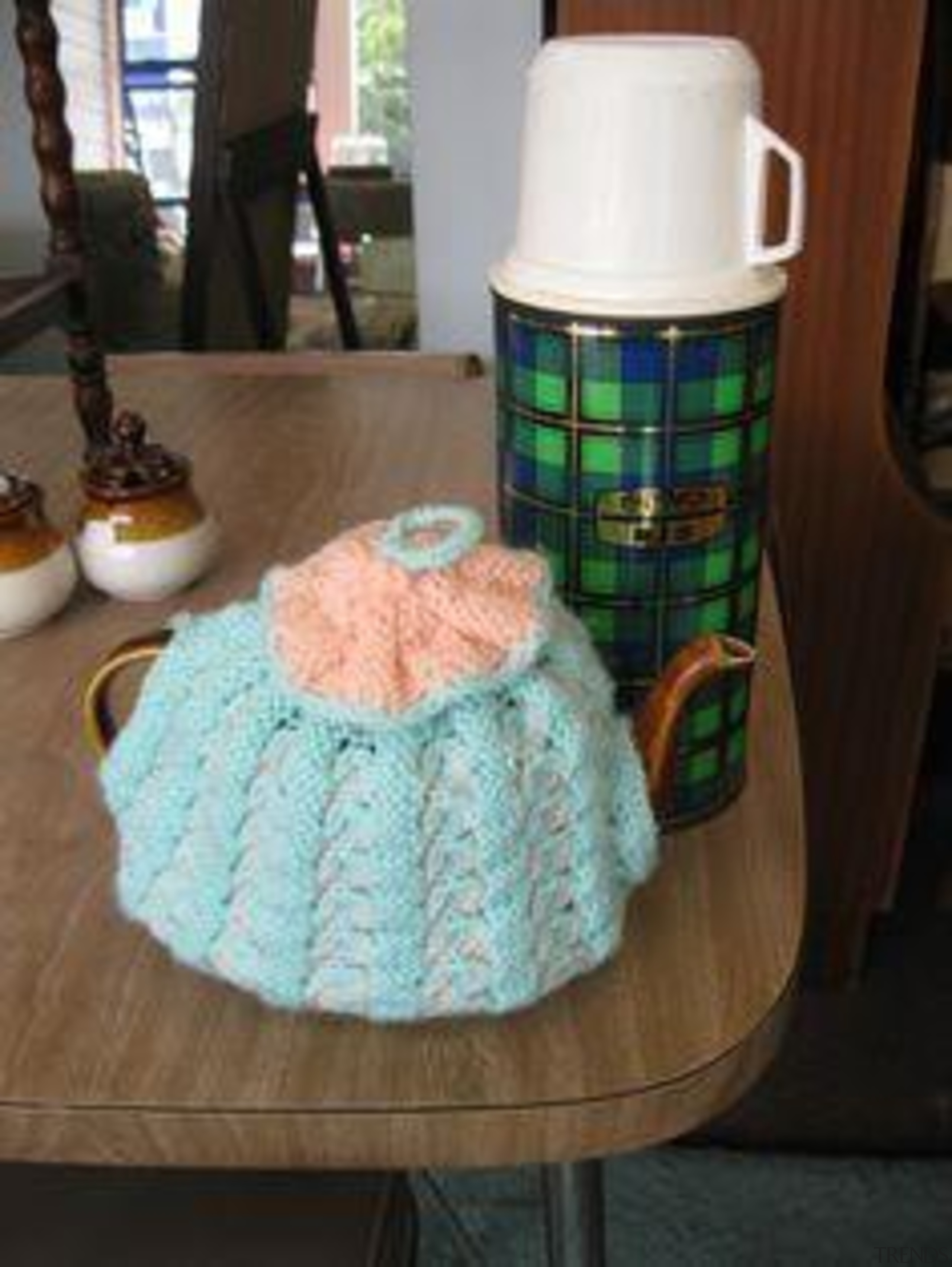 Woodgrain Formica, With Nan's tea cozy and tartan crochet, product, black, brown