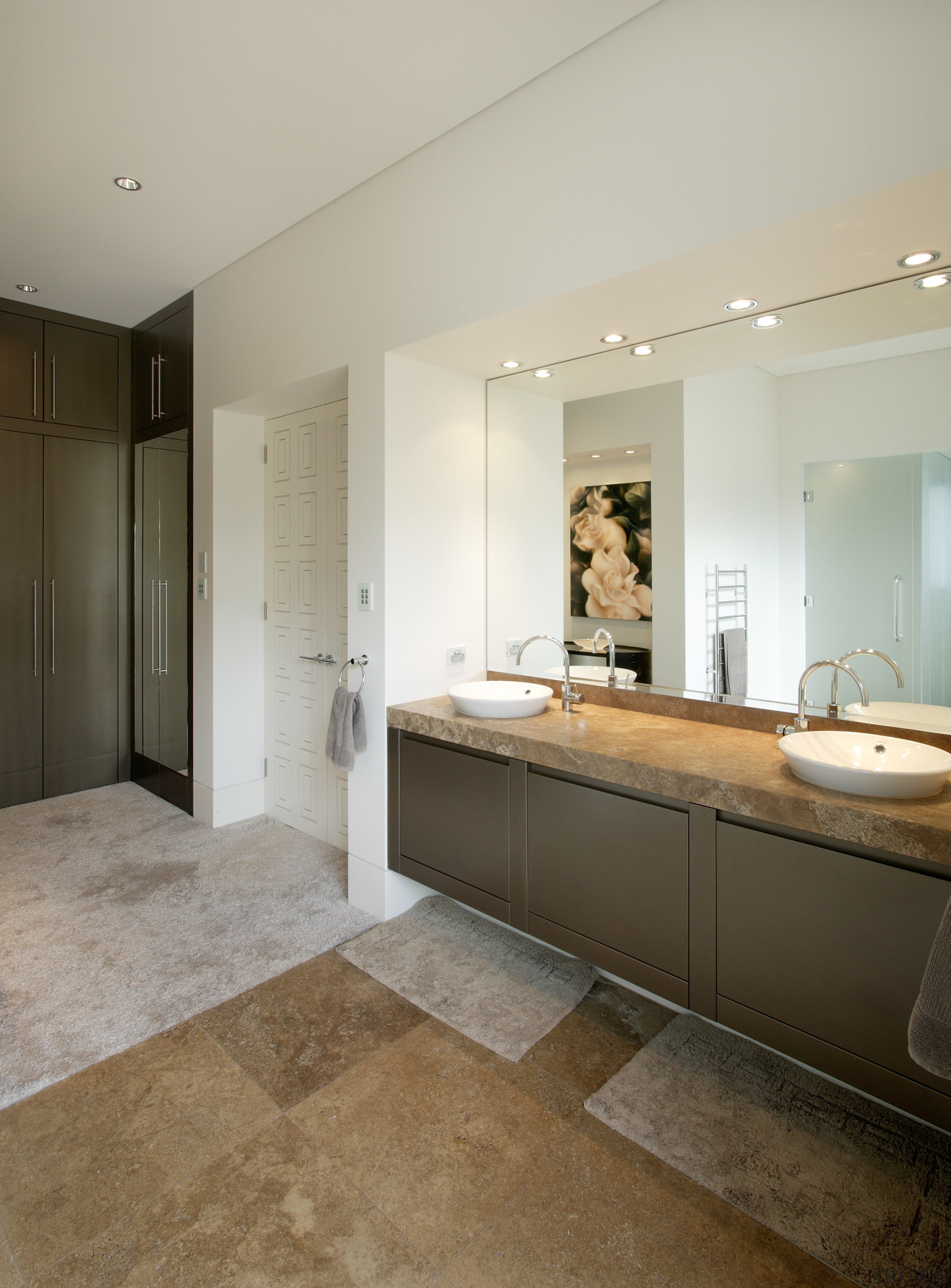 View of bathroom which features a vanity with bathroom, cabinetry, countertop, floor, flooring, home, interior design, kitchen, real estate, room, sink, tile, wood flooring, gray, brown