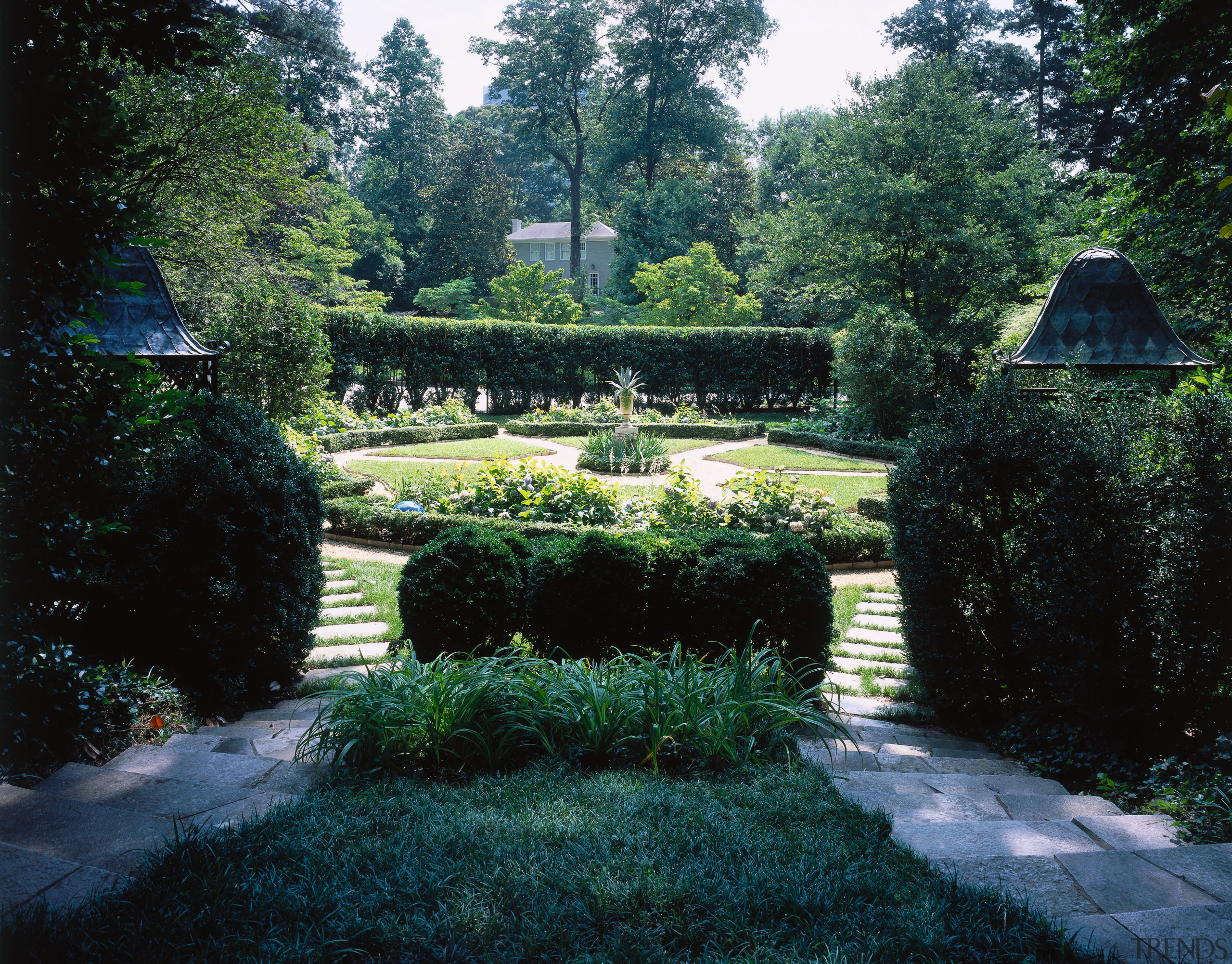 View of the courtyard entrance, stone steps, pebbled backyard, botanical garden, estate, garden, grass, hedge, house, landscape, landscaping, lawn, leaf, plant, shrub, tree, vegetation, walkway, yard, black