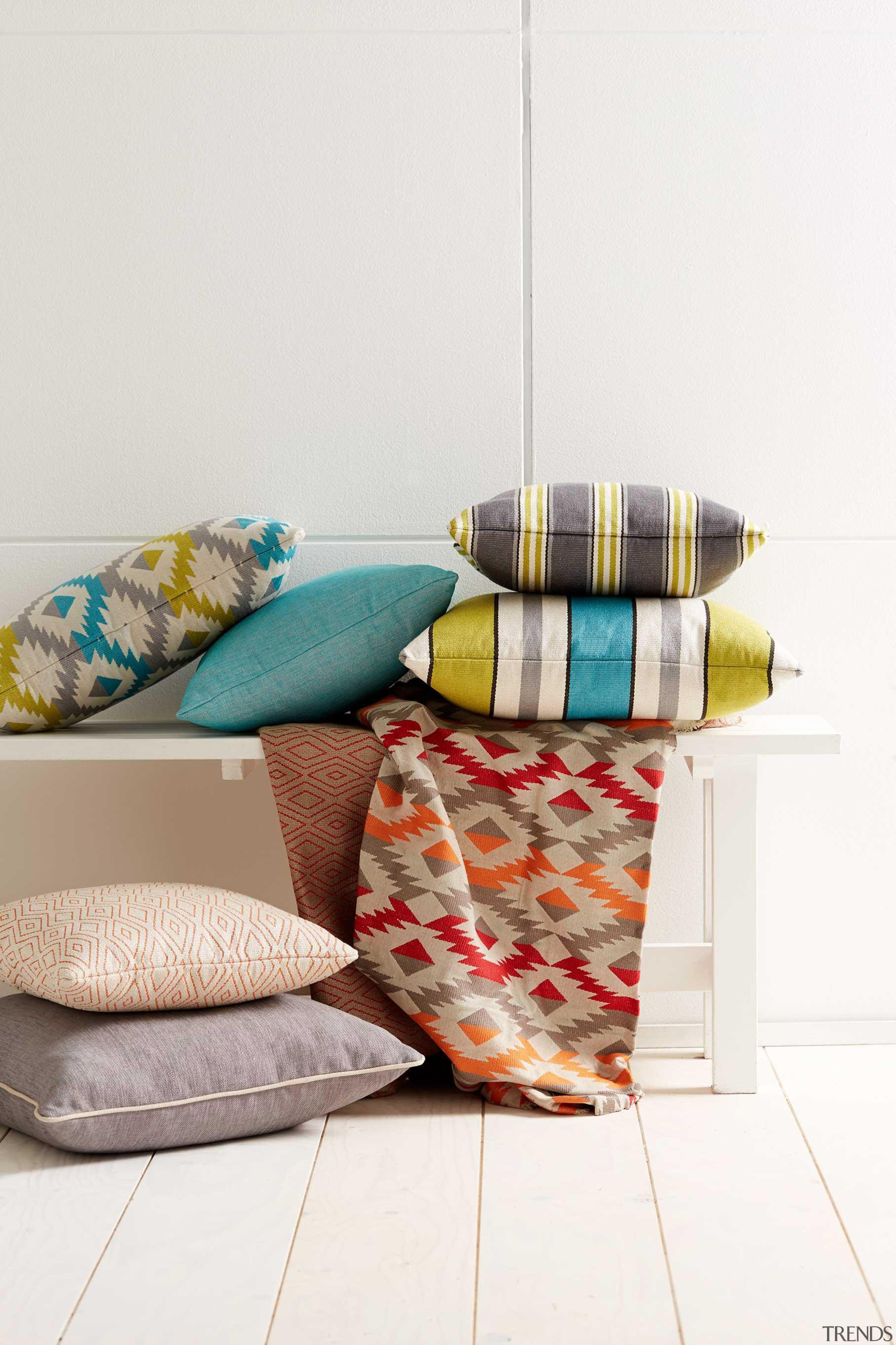 With a Mayan pattern influence, our latest collection couch, cushion, furniture, interior design, linens, pillow, product, table, textile, white