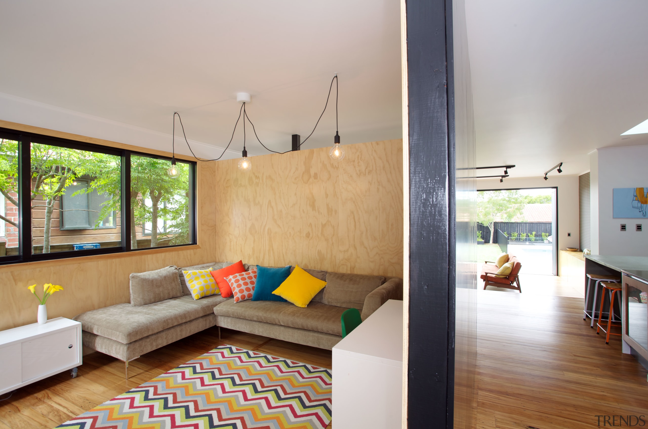 The media room in this renovated house is architecture, ceiling, daylighting, estate, floor, home, house, interior design, living room, real estate, room, gray
