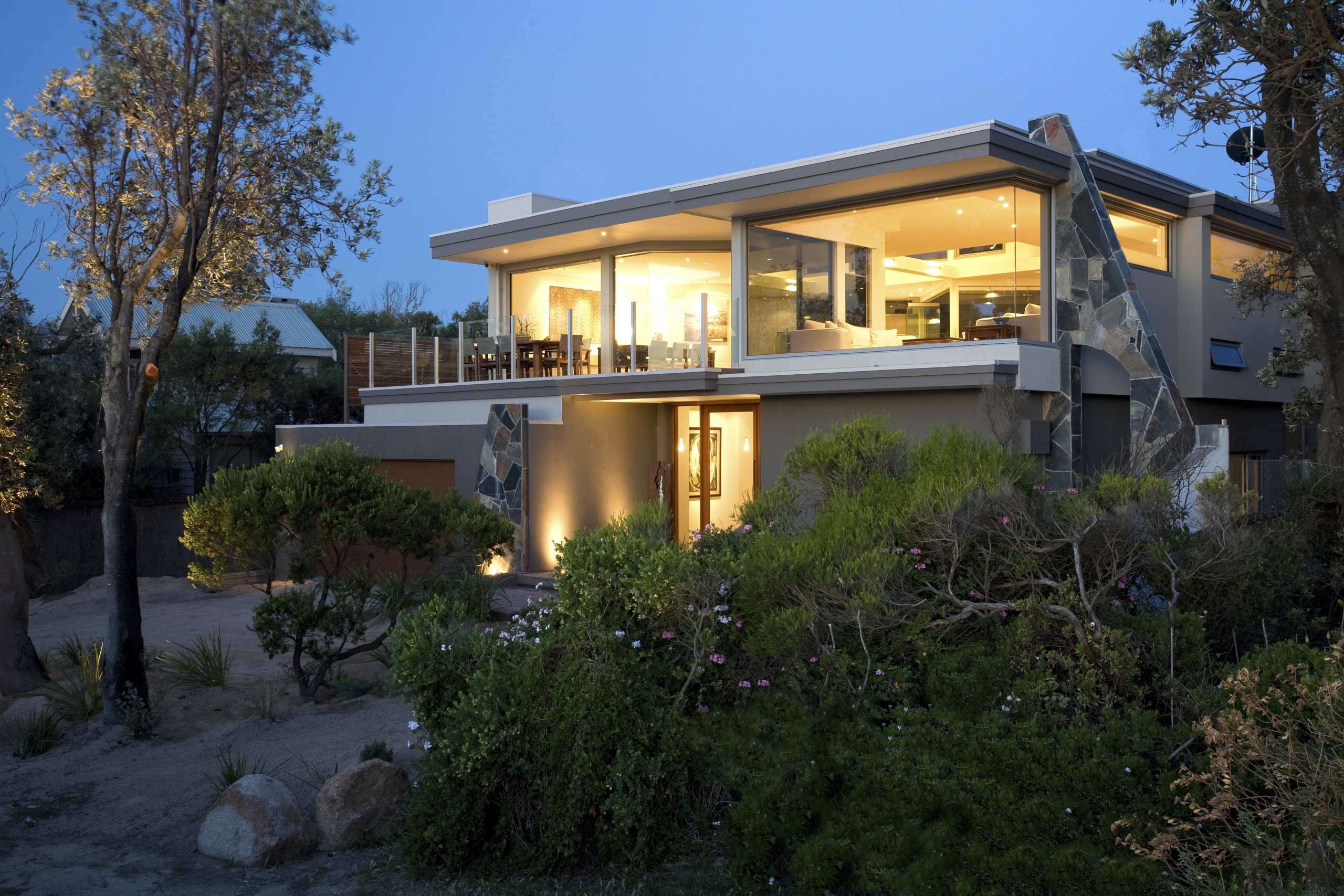 Exterior view of house with plants in foreground. architecture, building, cottage, estate, facade, home, house, property, real estate, residential area, villa, window, black