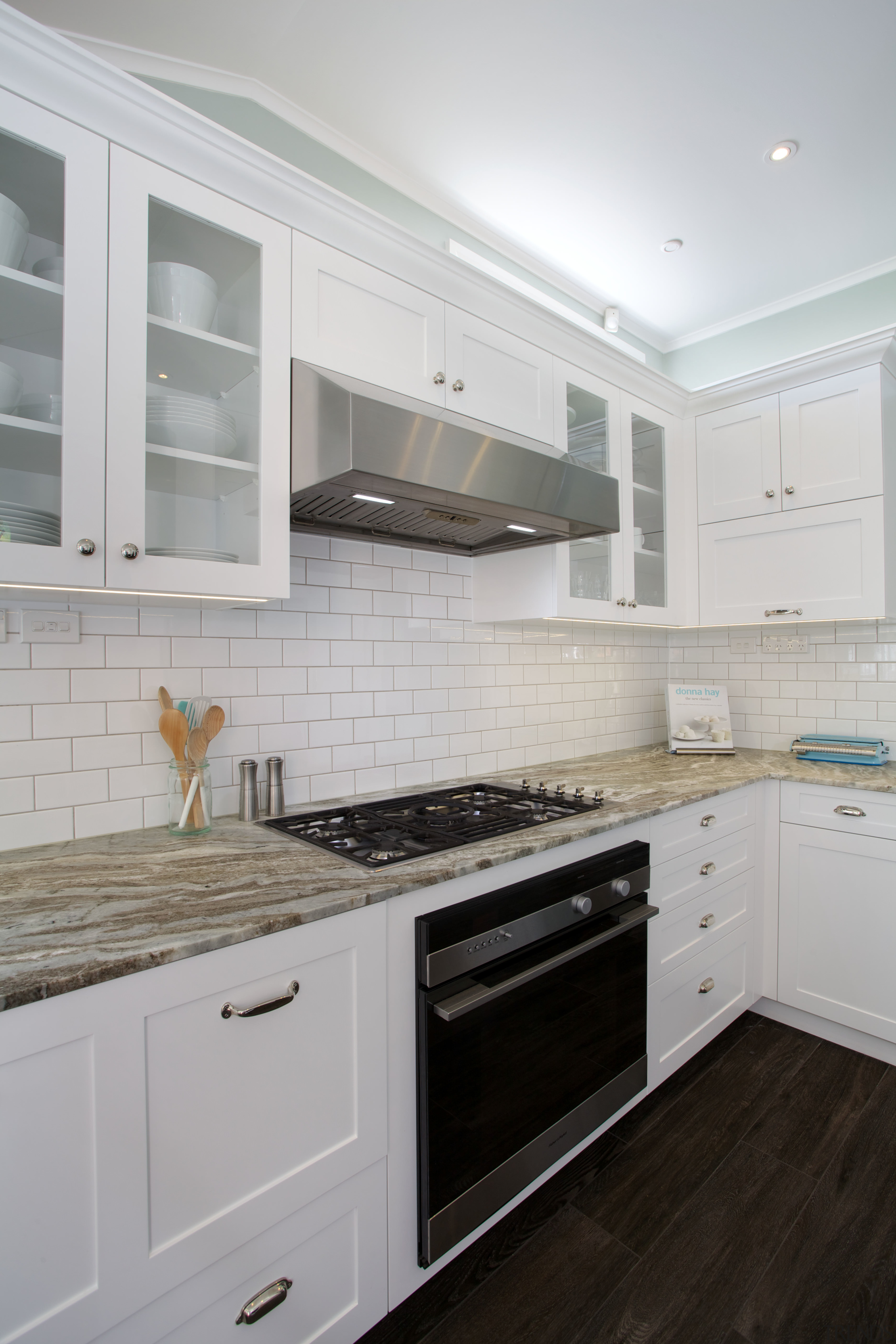 The ventilation unit in this kitchen was custom cabinetry, countertop, cuisine classique, floor, flooring, hardwood, home appliance, interior design, kitchen, kitchen appliance, kitchen stove, major appliance, room, tile, wood flooring, gray