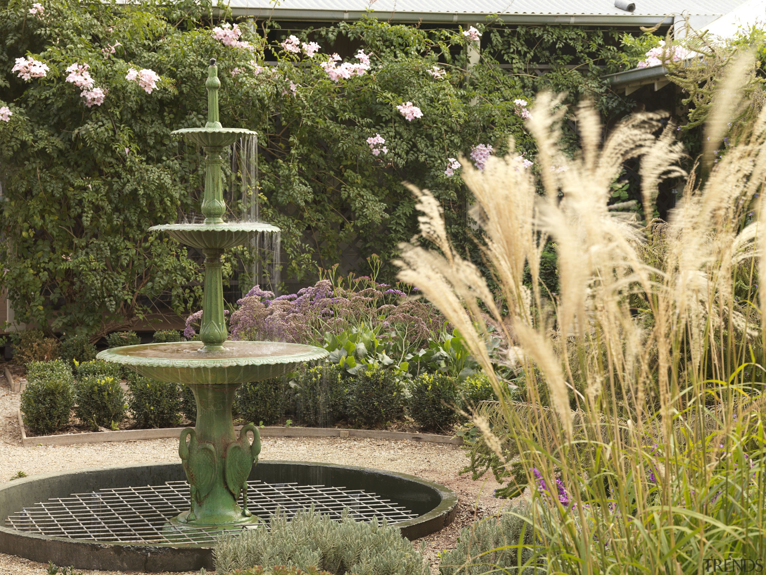 View of garden which features an antique fountain backyard, botanical garden, garden, grass, grass family, landscape, landscaping, outdoor structure, plant, shrub, water feature, yard, brown