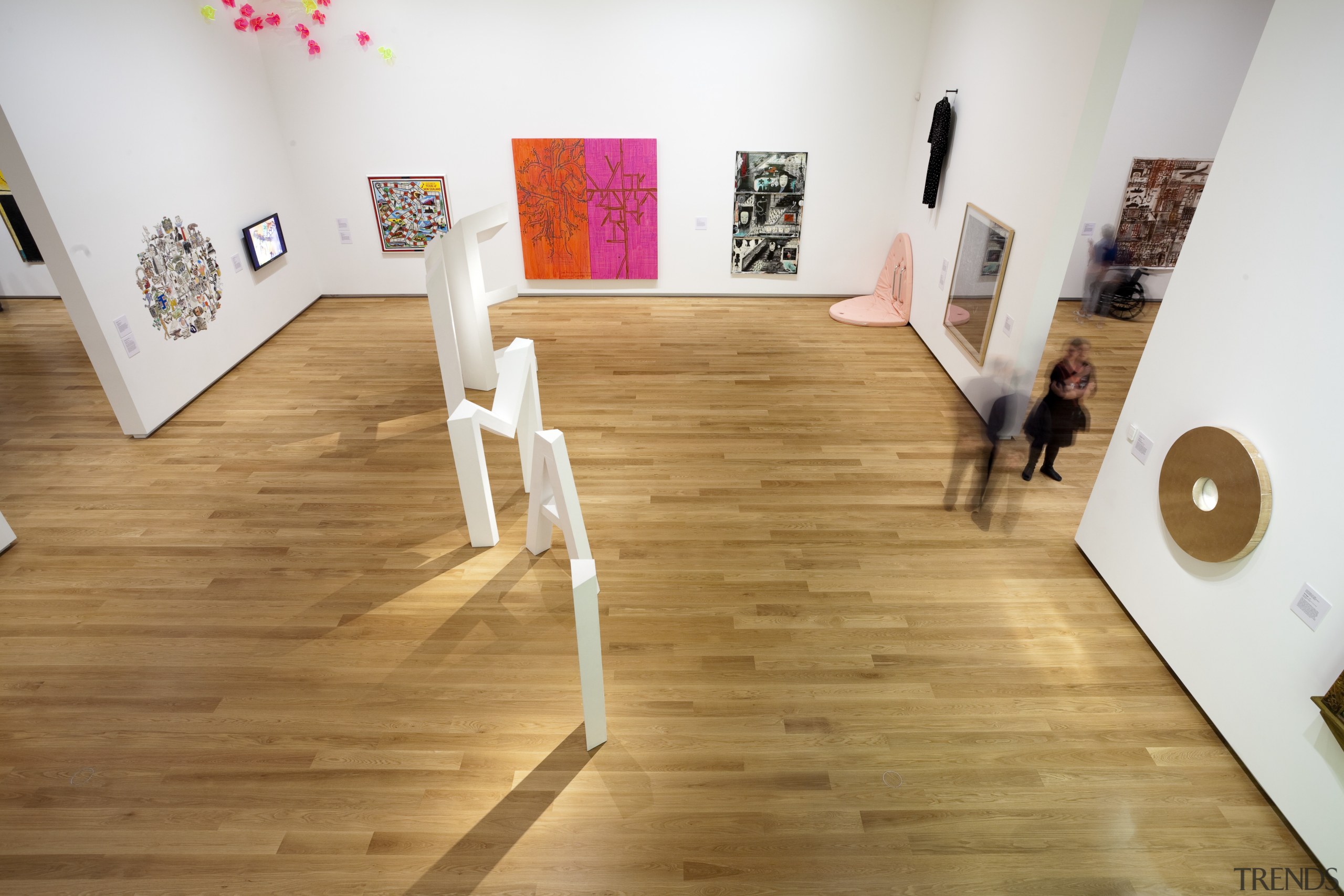 Here is a view of the hardwood flooring art gallery, exhibition, floor, flooring, furniture, hardwood, interior design, laminate flooring, product design, room, table, wood, wood flooring, white, orange