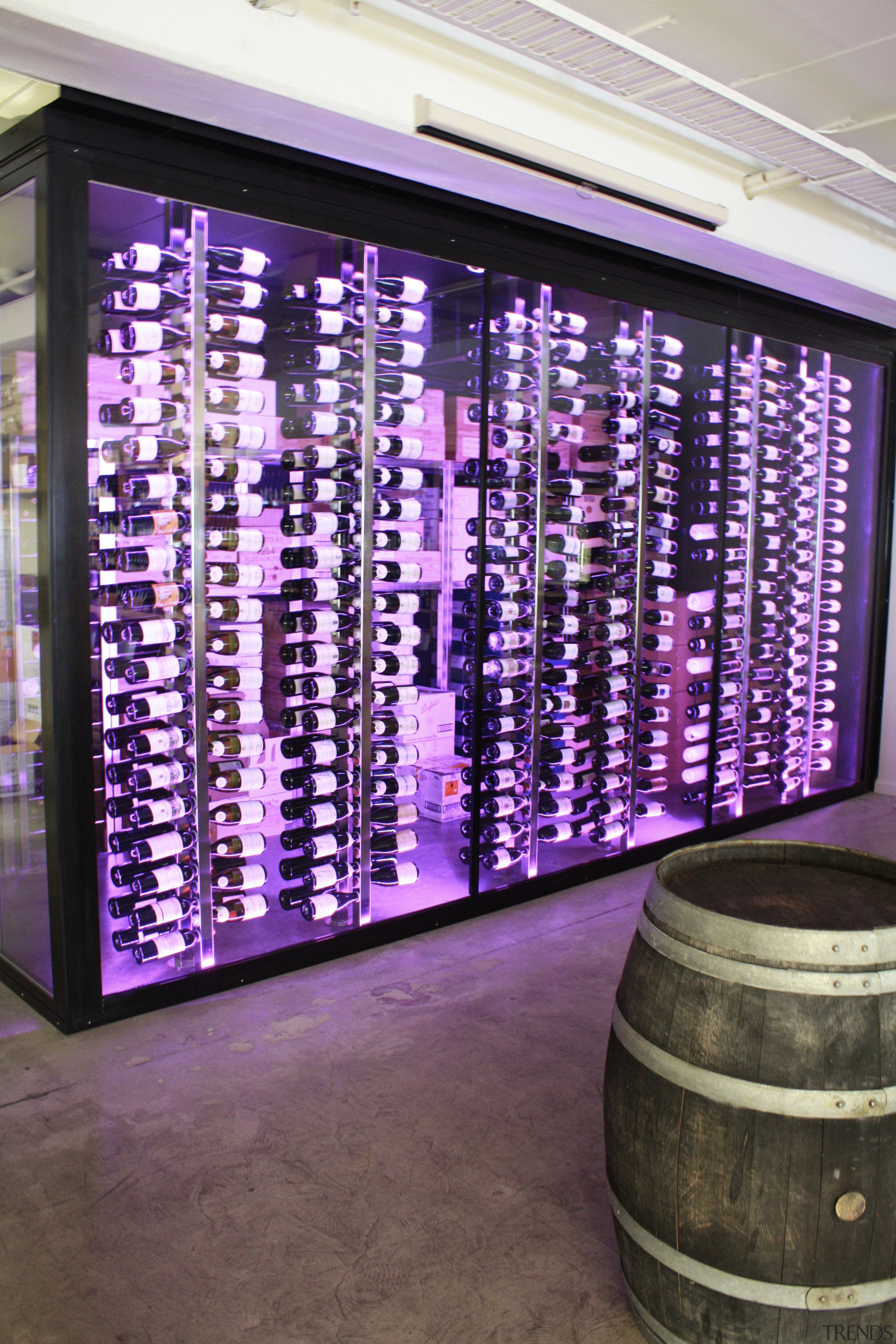 View of refrigeration solution at wine retailer. - display case, interior design, purple, wine cellar, purple