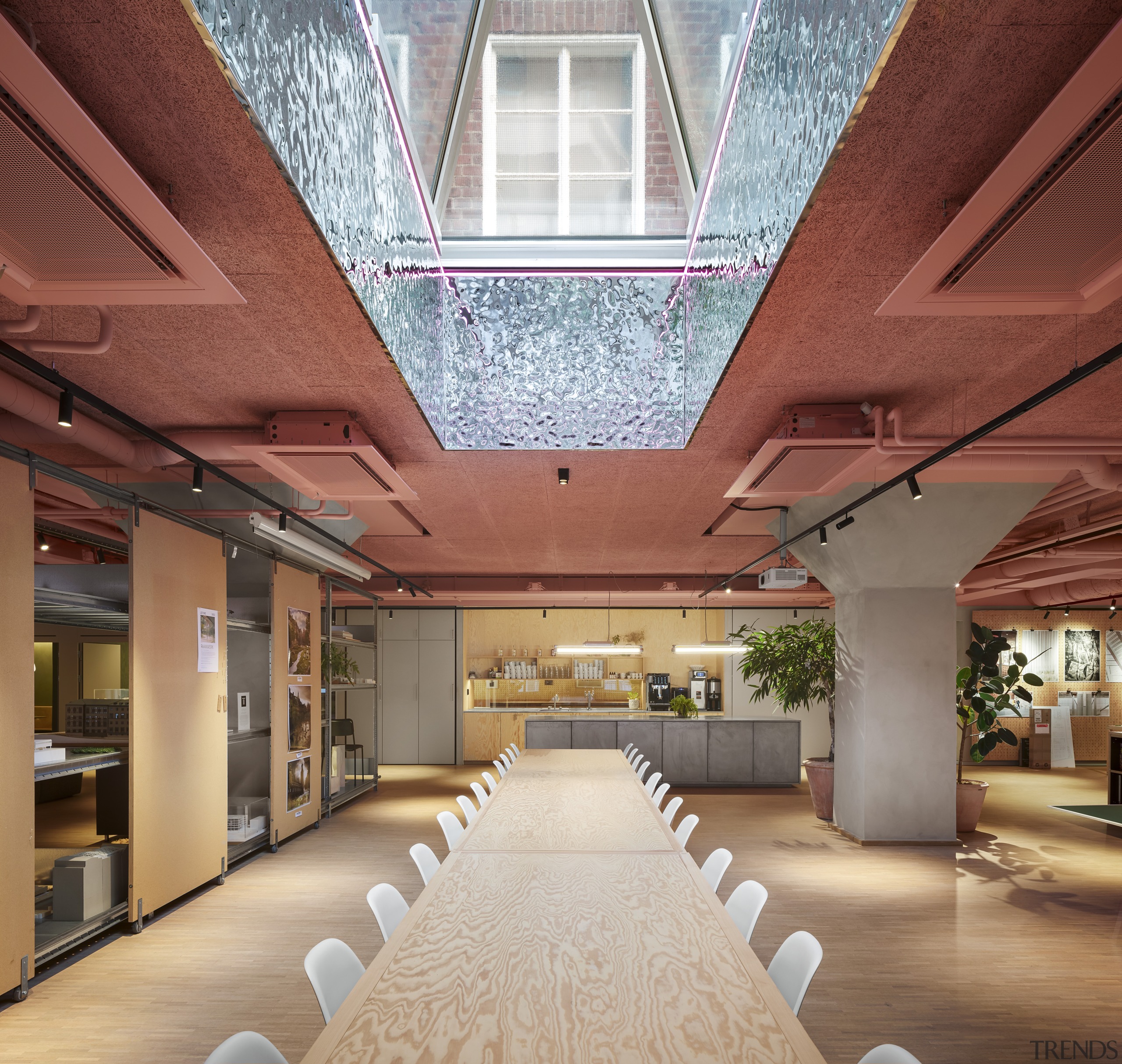 A large skylight sits above the long group 