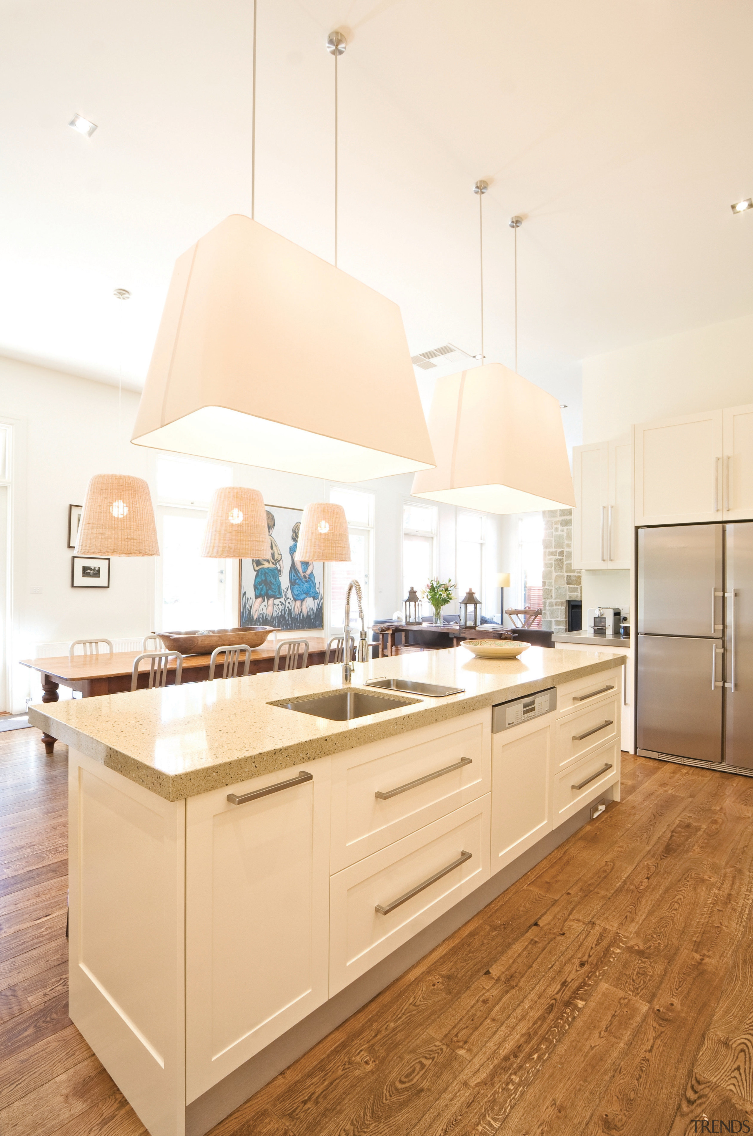 View of a kitchen island with composite stone cabinetry, countertop, cuisine classique, floor, interior design, kitchen, room, white, orange