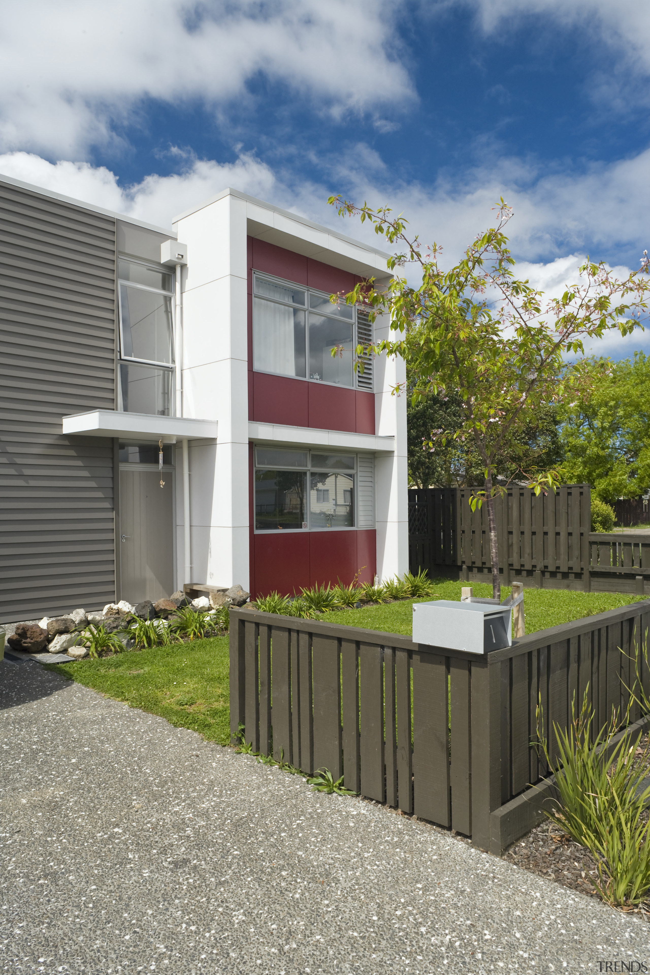 This Housing New Zealand Devlopment features modular homes, architecture, building, cottage, facade, home, house, property, real estate, residential area, gray