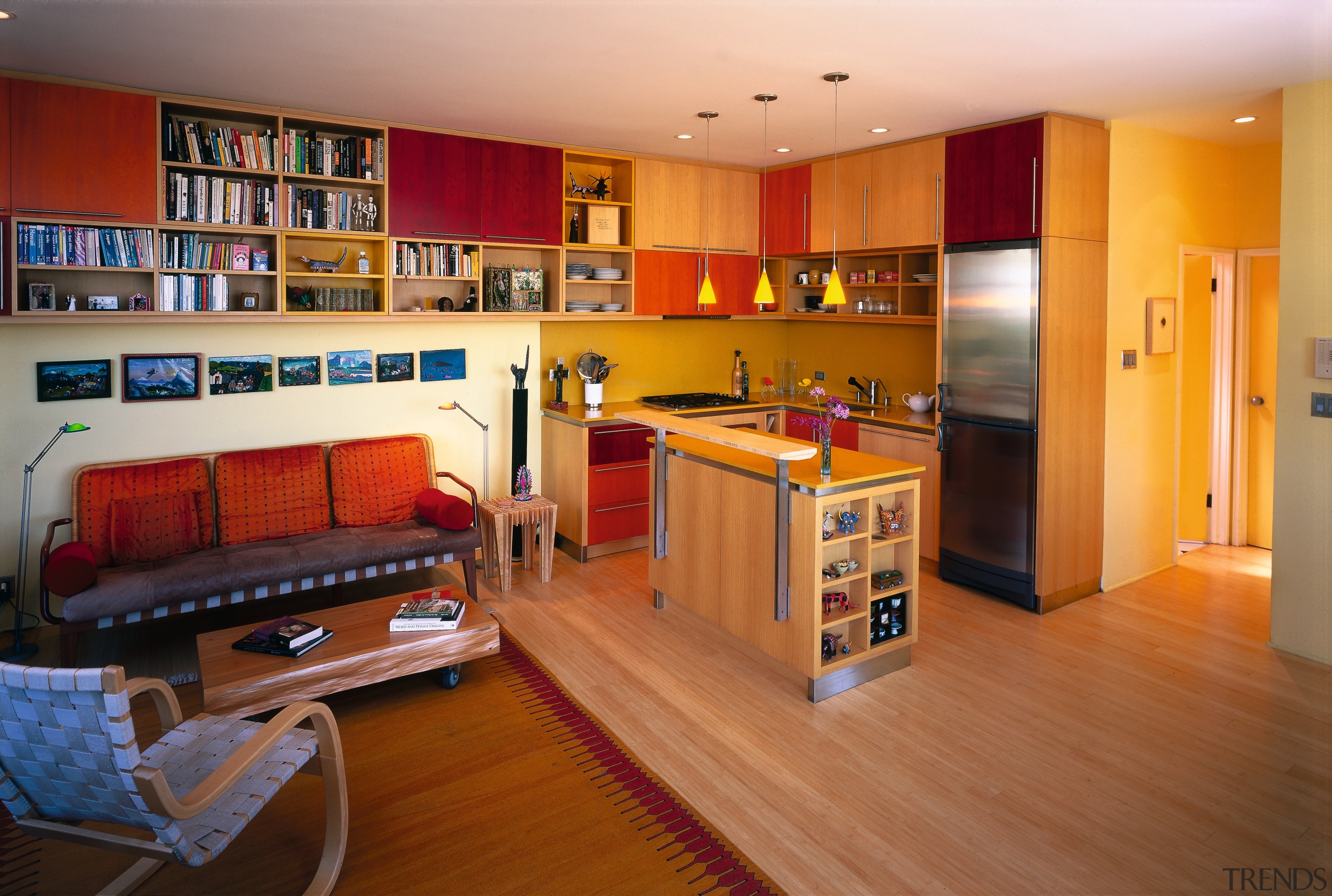 A view of the kitchen and living area, floor, flooring, hardwood, home, interior design, living room, room, wood, brown, orange