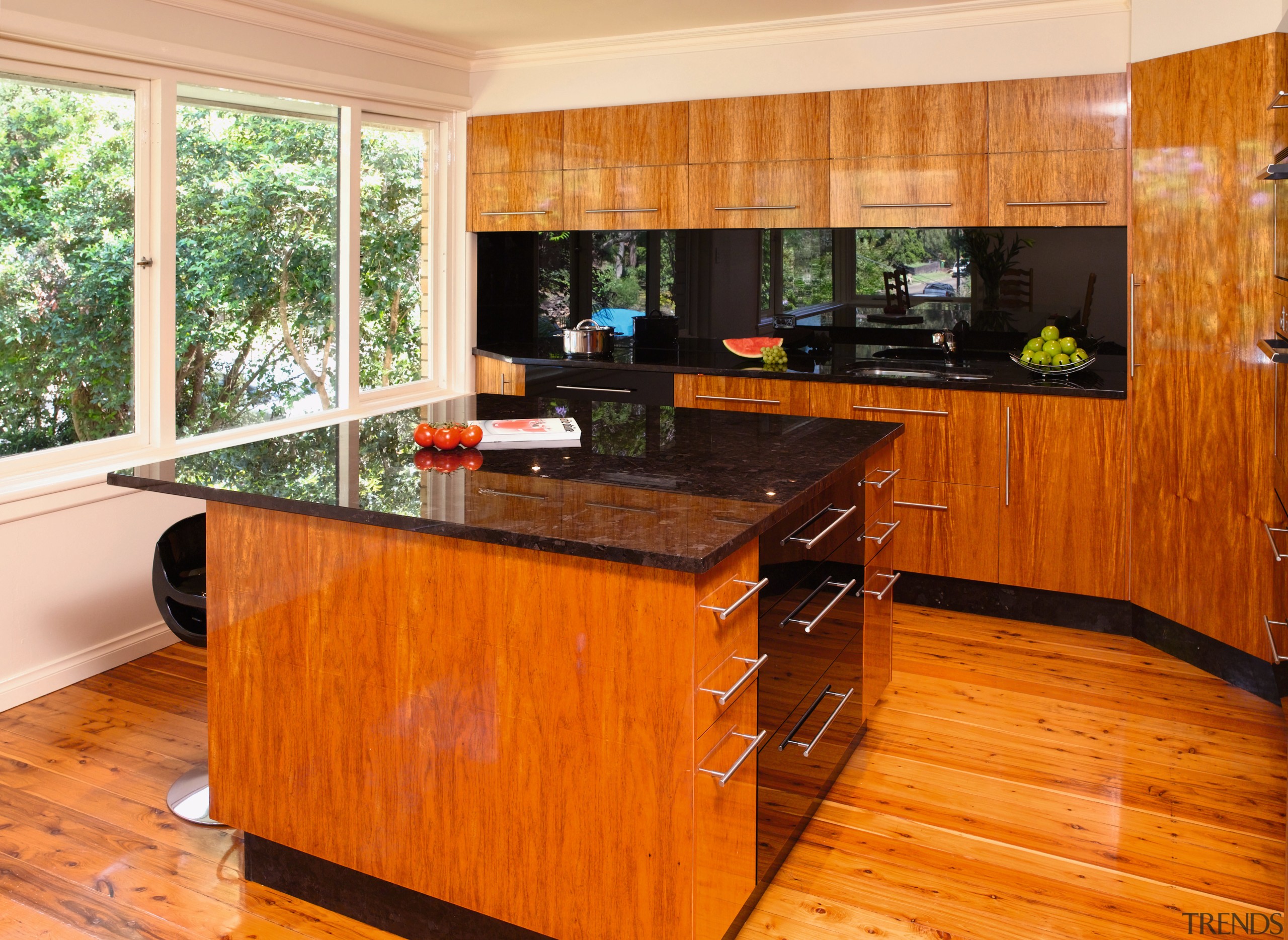 Kitchen with timber veneer, black glass splashback, brown cabinetry, countertop, floor, flooring, hardwood, interior design, kitchen, laminate flooring, real estate, room, wood, wood flooring, wood stain, brown, orange