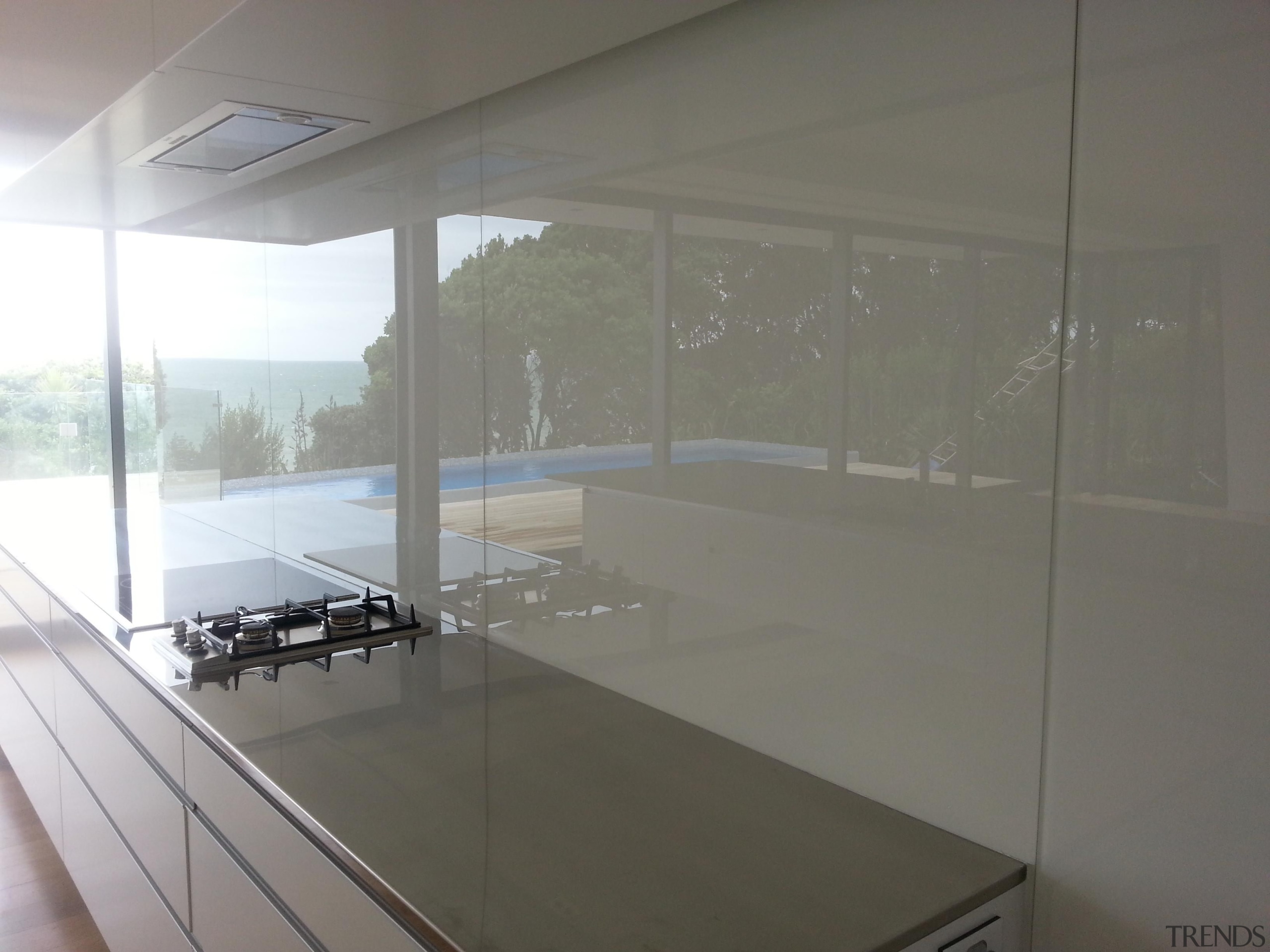 White Standard Glass Splashback.  The splashback looks architecture, daylighting, floor, glass, house, interior design, property, real estate, window, gray