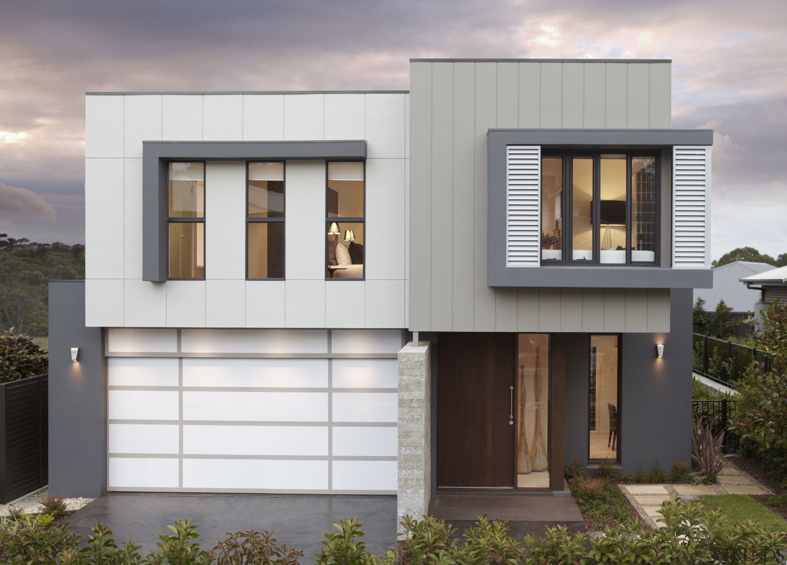 Exterior with white garage door and grey cladding. architecture, building, elevation, facade, home, house, property, real estate, residential area, siding, window, gray