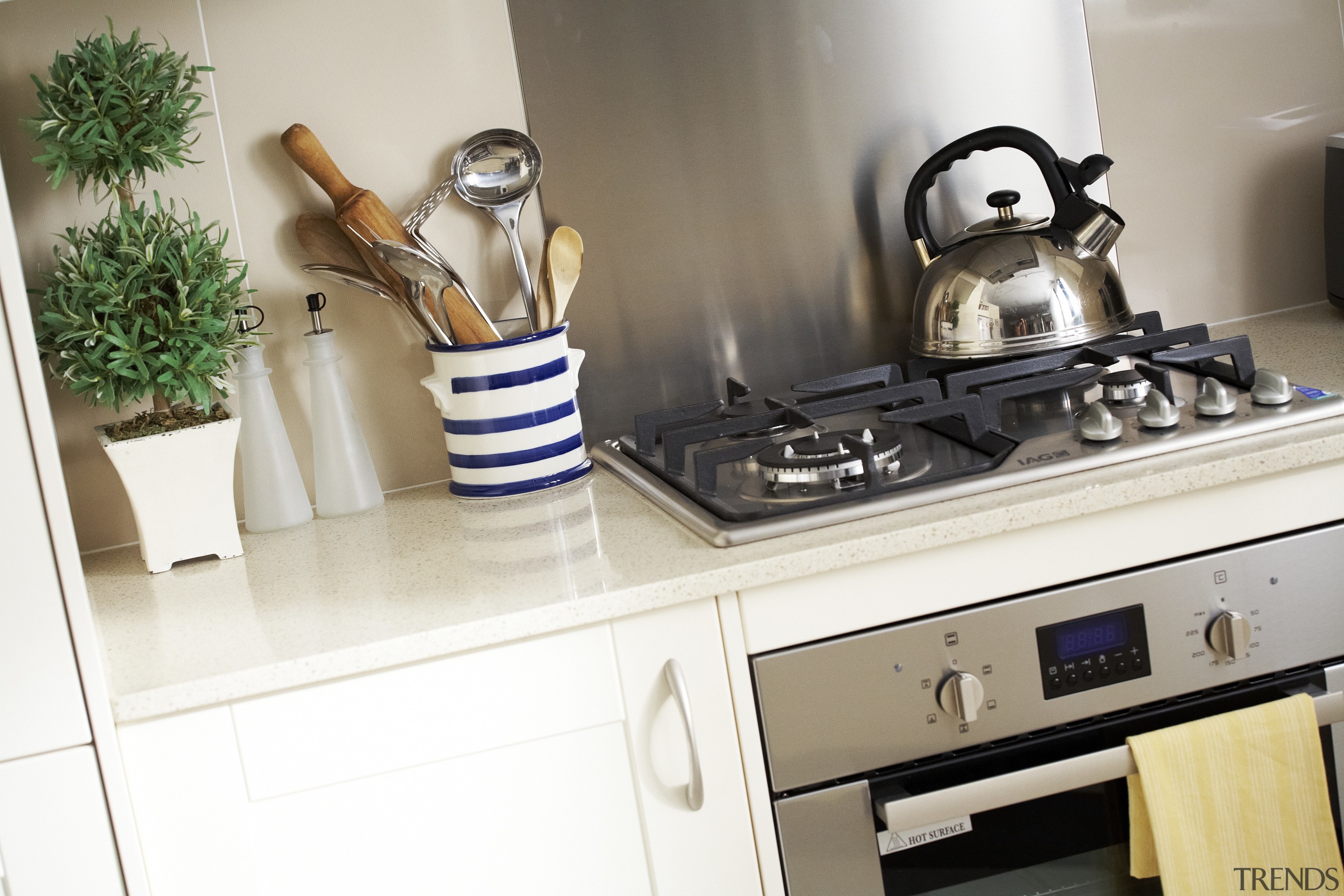 View of a kitchen designed by designers at countertop, furniture, interior design, kitchen, room, white