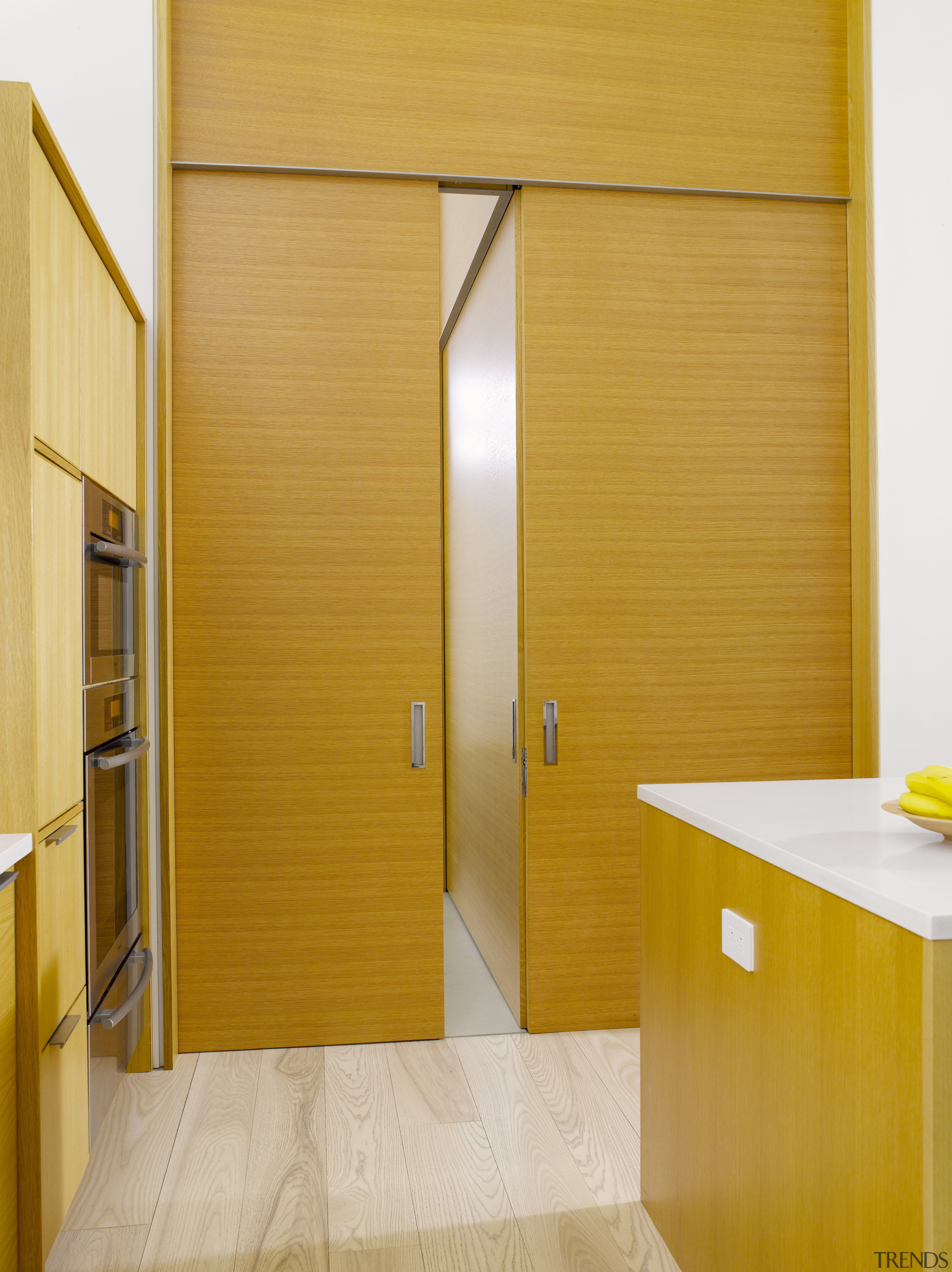 Seen here is a kitchen designed by Geoffrey door, floor, interior design, wall, wood, yellow, orange