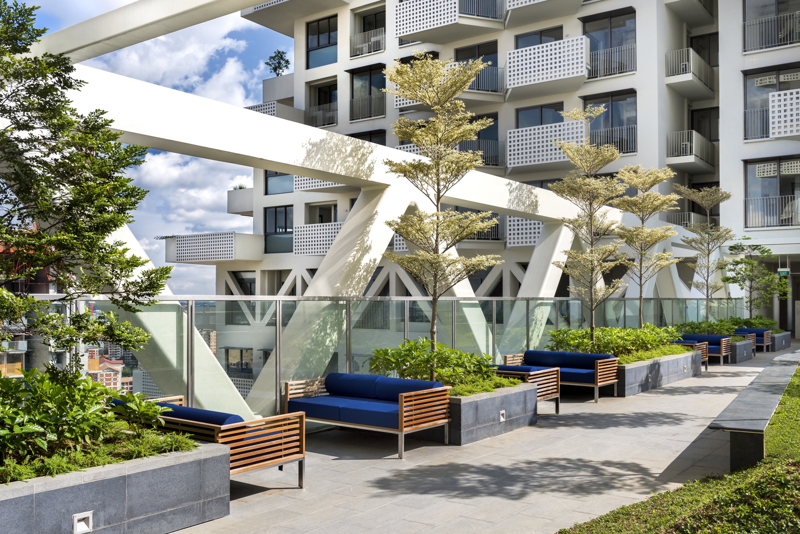 Landscaping and seating on the level 26 sky apartment, architecture, condominium, courtyard, home, mixed use, outdoor structure, plant, property, real estate, residential area, tree, white, gray