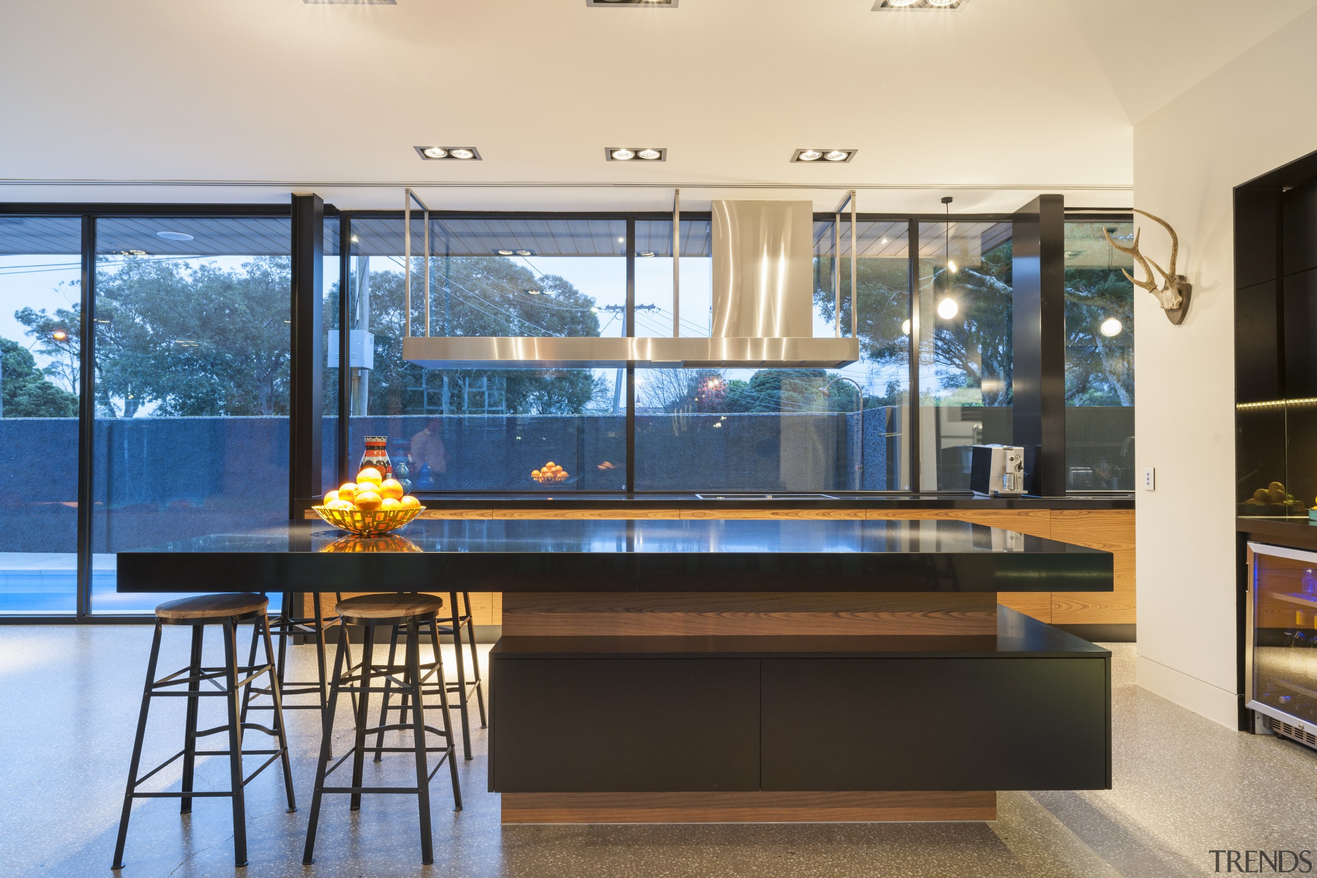 Rich orange wood veneer balances jet black engineered interior design, real estate, table, window, orange