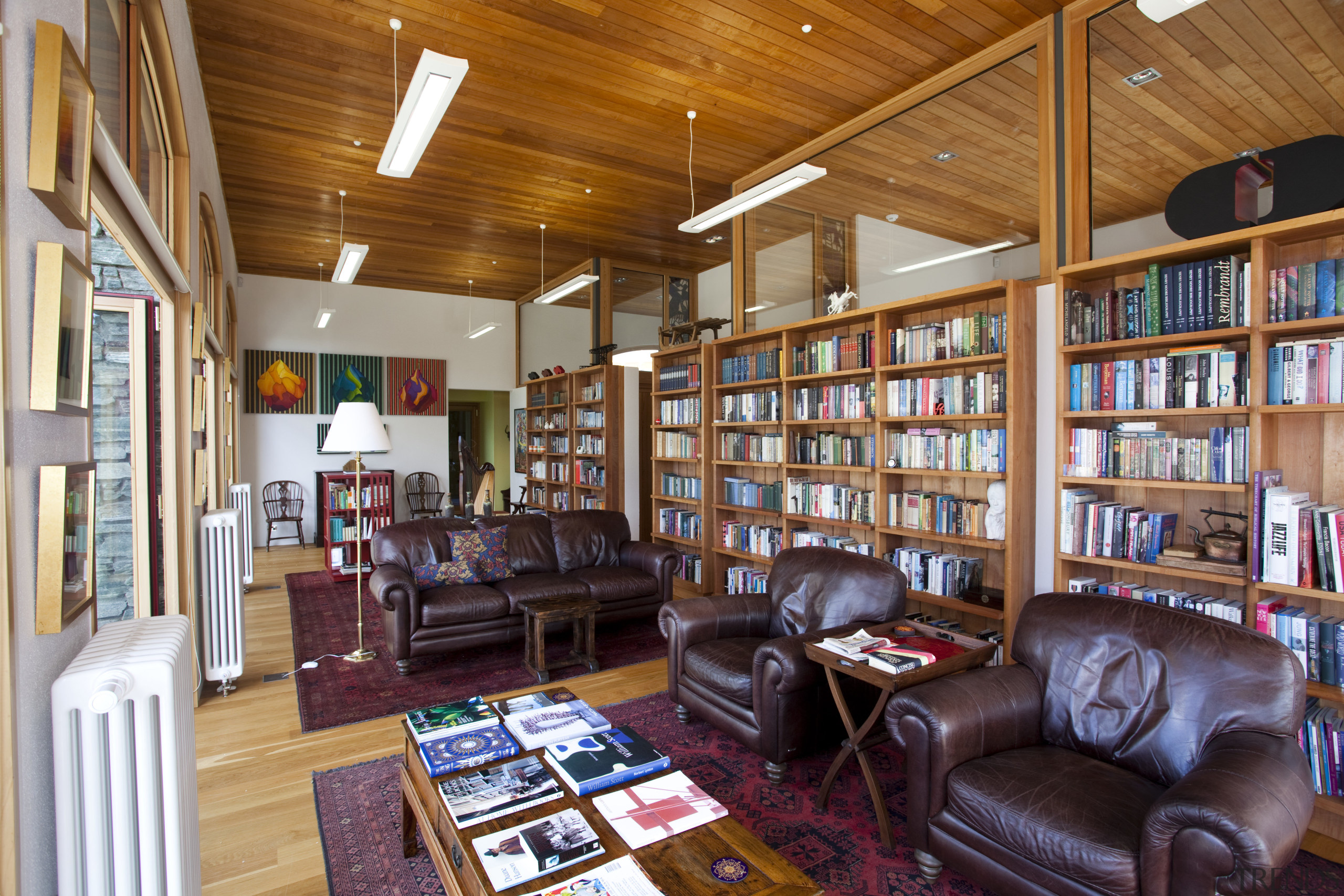 This home in Queenstown was renovated by architect antiquarian, bookcase, bookselling, institution, interior design, library, library science, living room, public library, real estate, brown