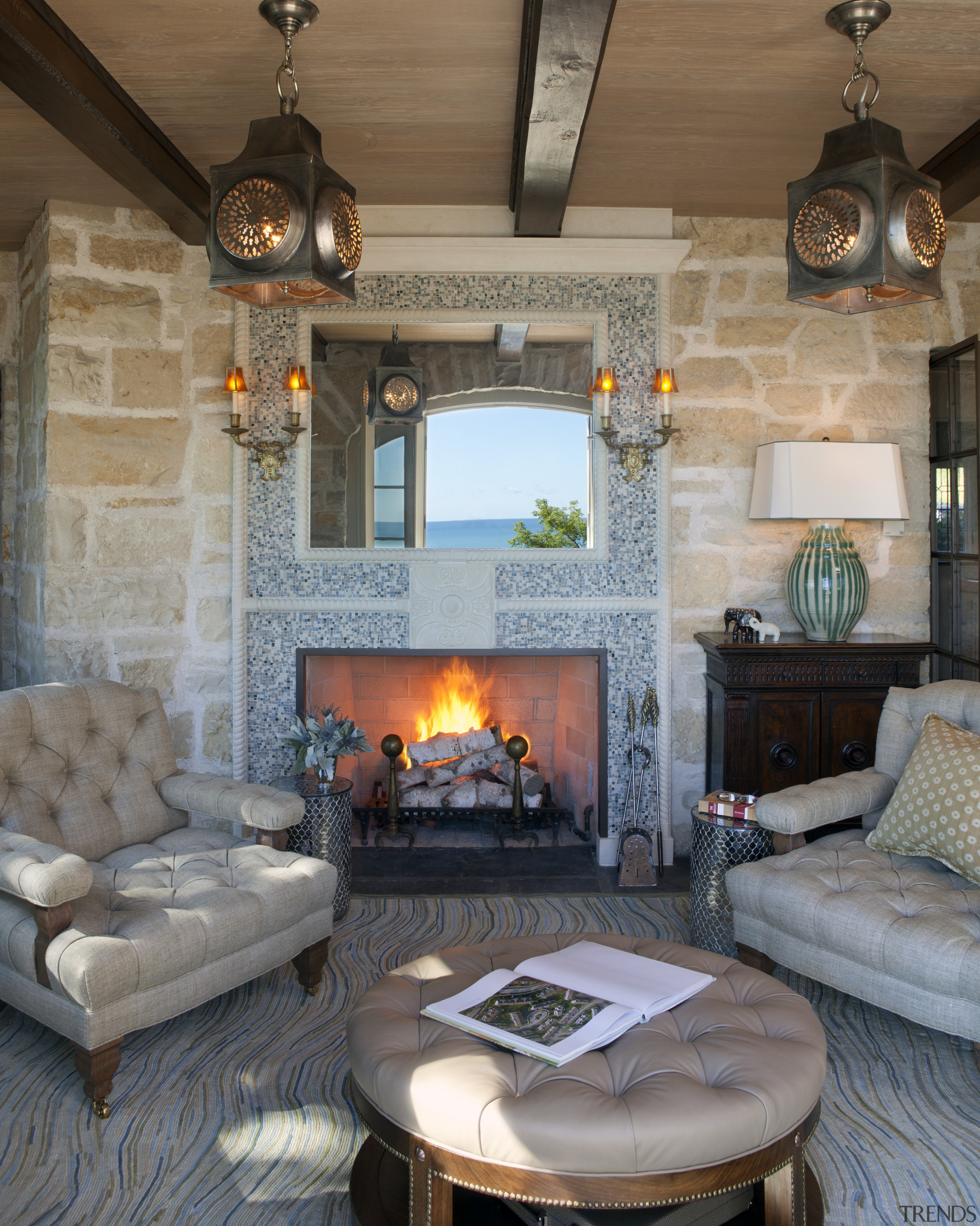 Seen here is a home that's interior was fireplace, hearth, home, interior design, living room, room, wall, gray