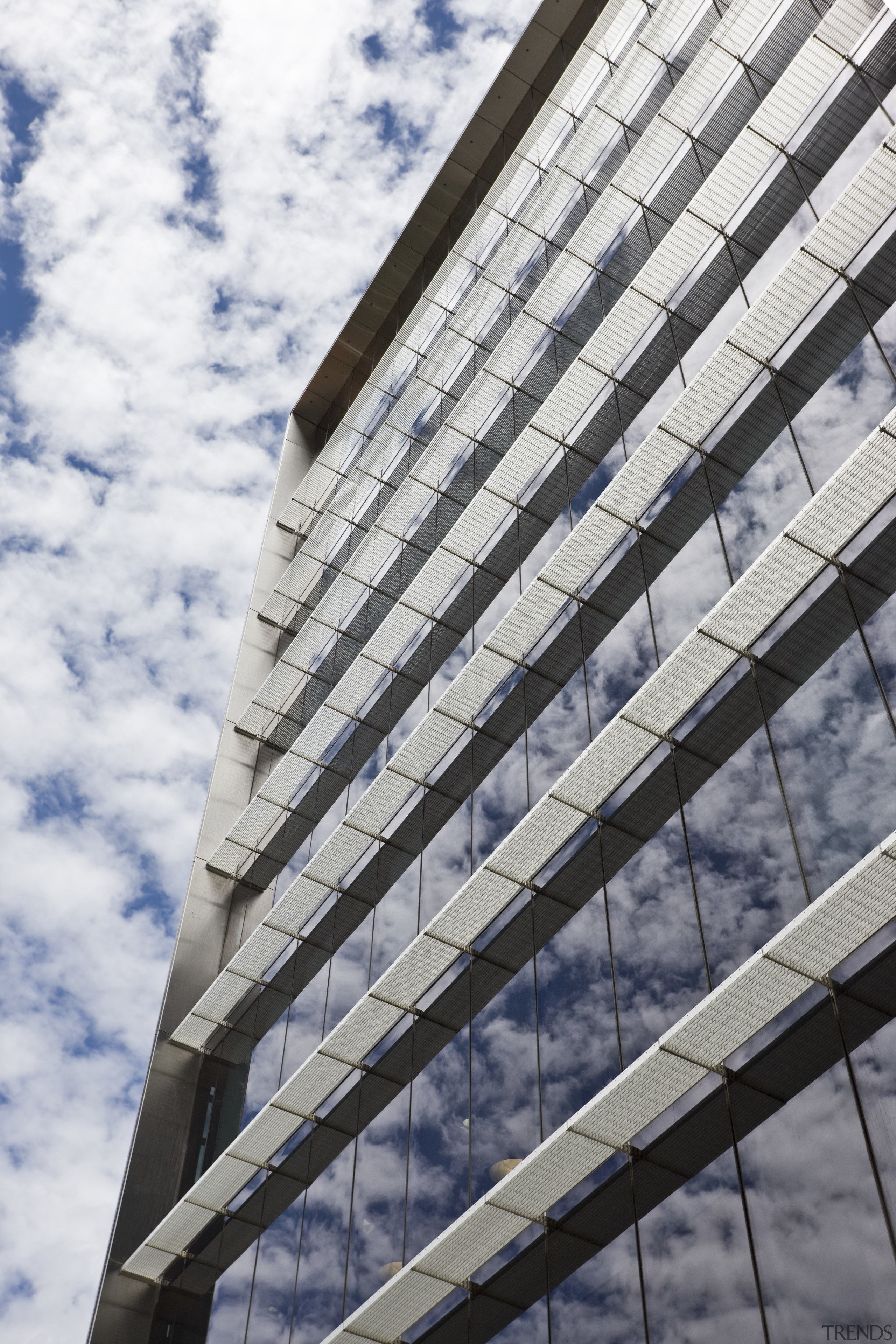 Exterior view of the eco-friendly commercial office tower angle, architecture, building, commercial building, condominium, corporate headquarters, daylighting, daytime, facade, headquarters, landmark, line, metropolis, metropolitan area, reflection, residential area, sky, skyscraper, structure, tower block, urban area, window, white