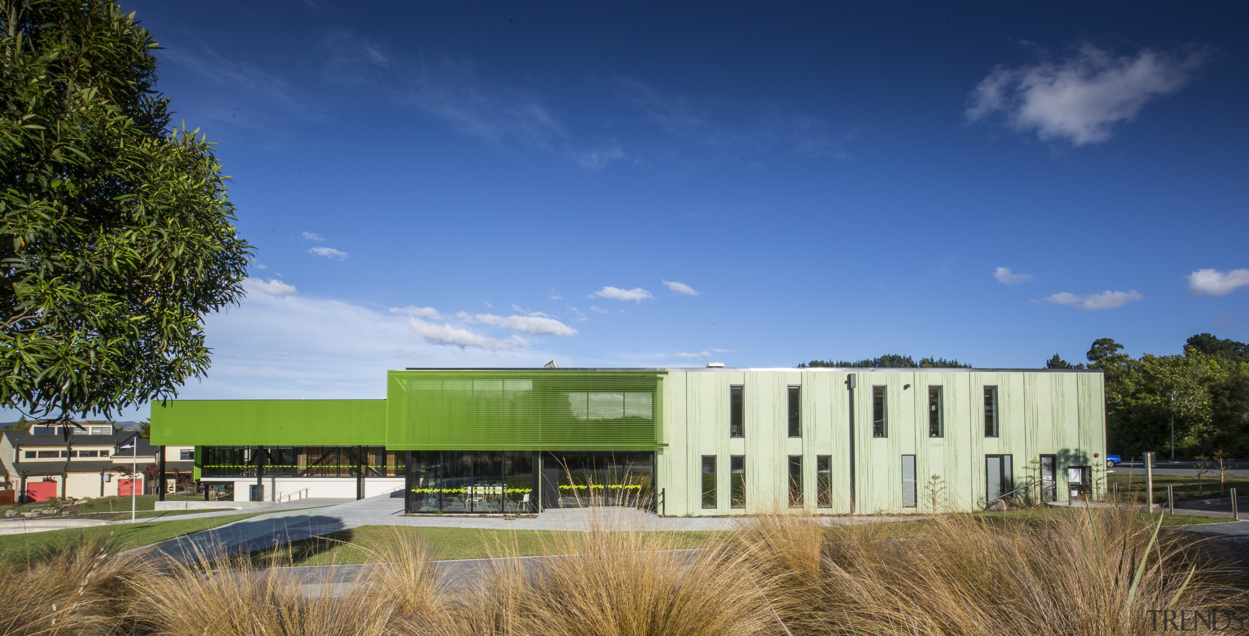 :Green mesh and patterned, pigmented green concrete envelope architecture, campus, cloud, corporate headquarters, daytime, estate, facade, grass, headquarters, home, house, property, real estate, sky, blue