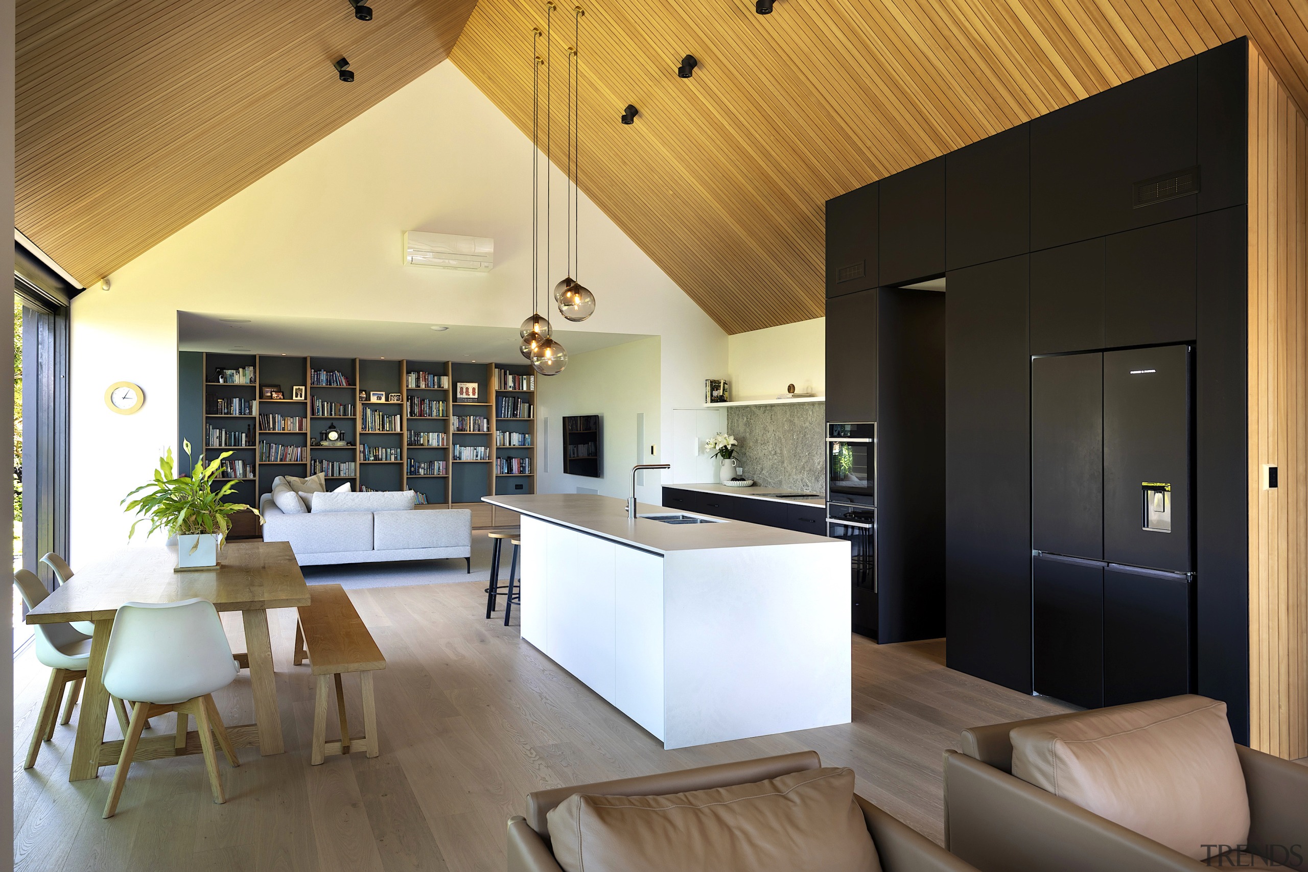 A wall of artistically designed book shelving is 