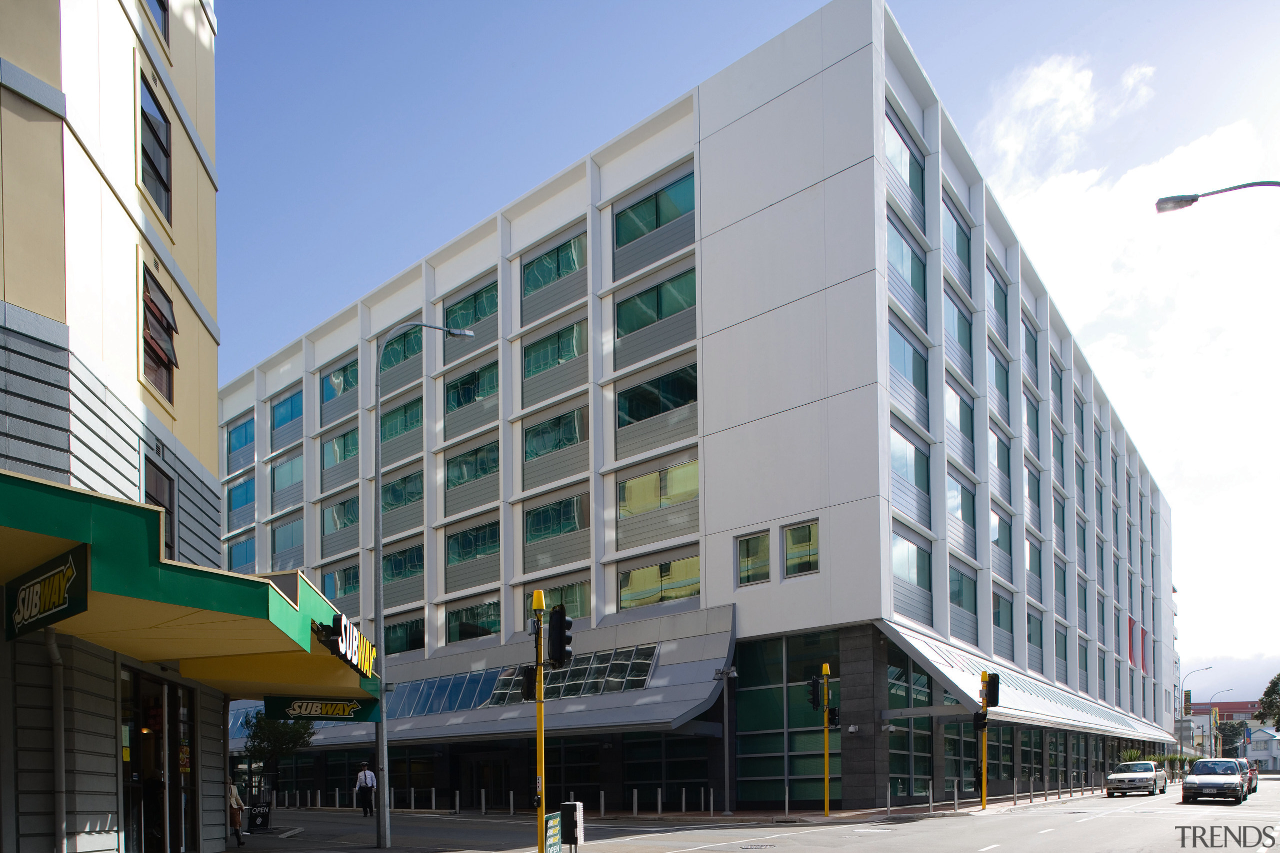 A view of the Headquarters for the New apartment, architecture, building, commercial building, condominium, corporate headquarters, facade, headquarters, metropolitan area, mixed use, neighbourhood, real estate, residential area, gray