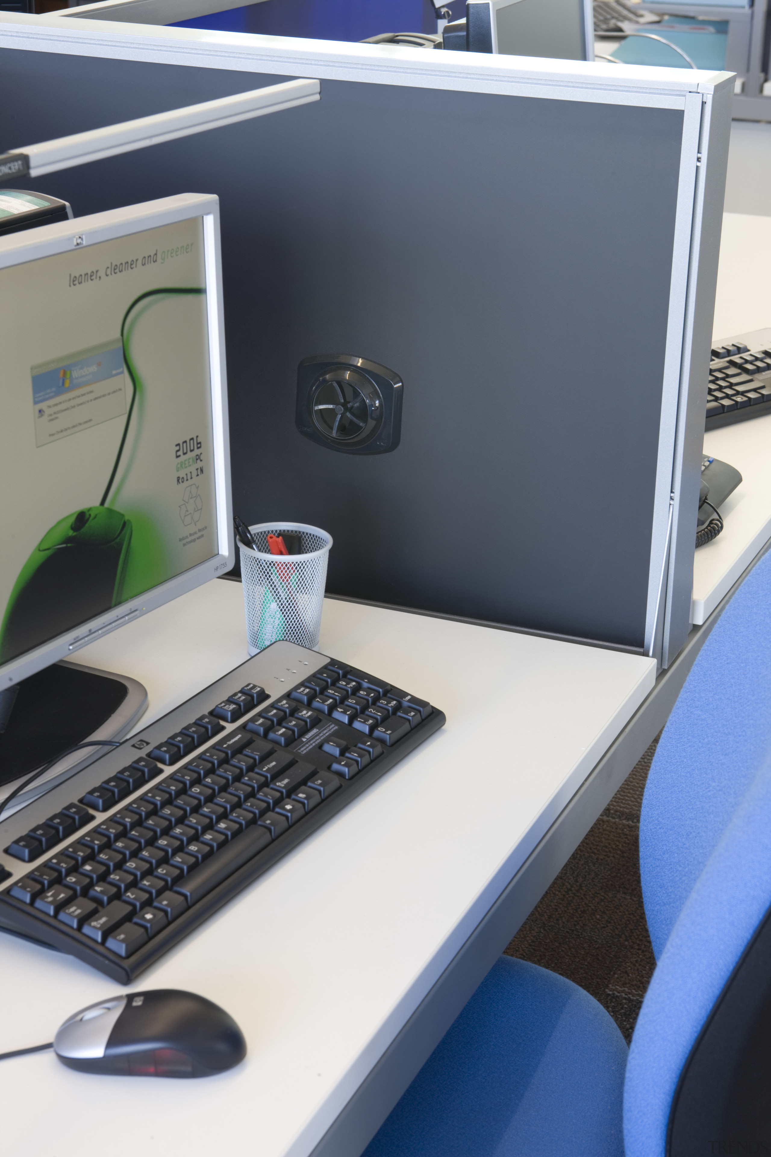 View of an office work station which features computer hardware, desk, desktop computer, display device, electronic device, furniture, laptop, office, personal computer, personal computer hardware, product, product design, technology, white