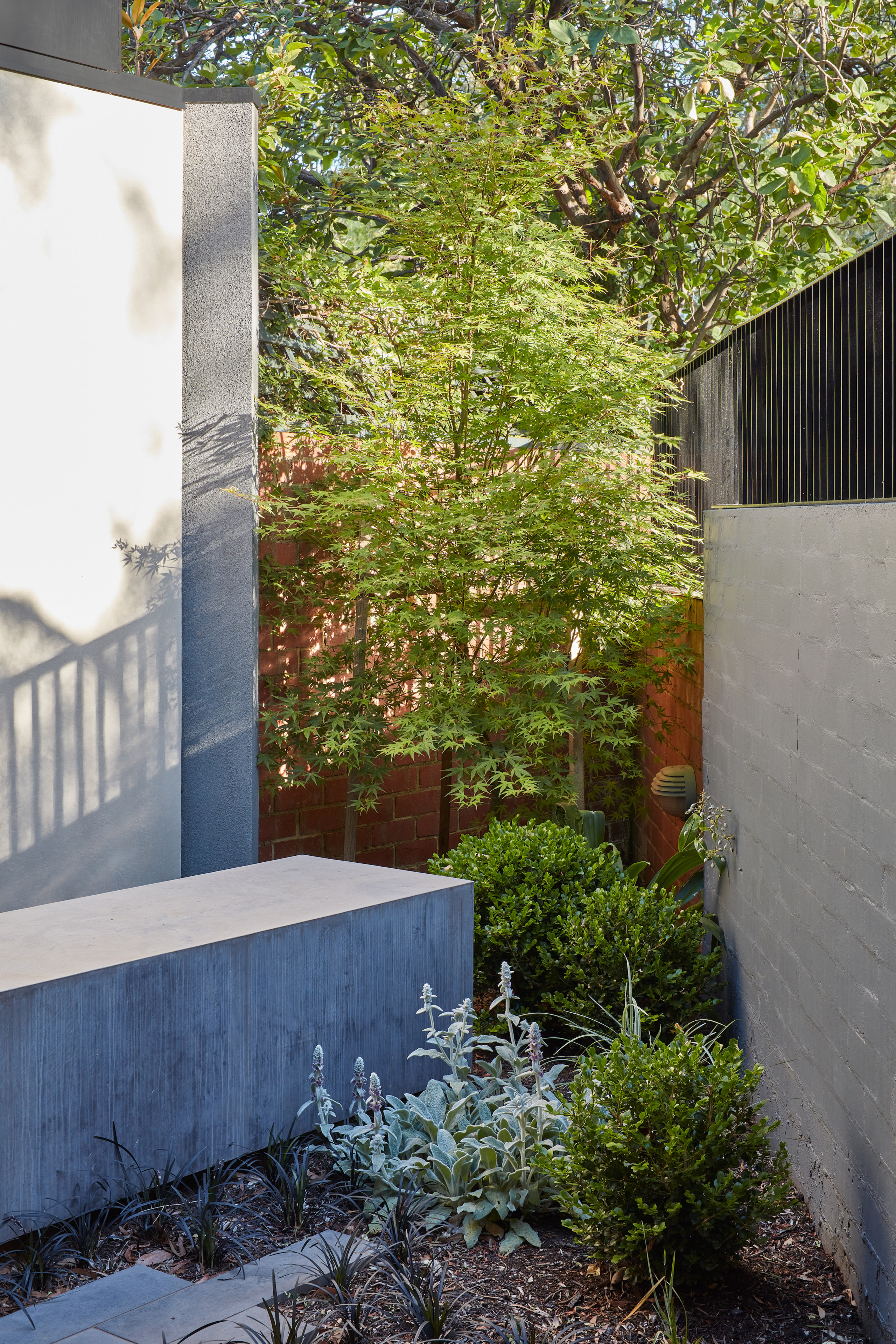 Existing brickwork meets new concrete in the renovation/extension 